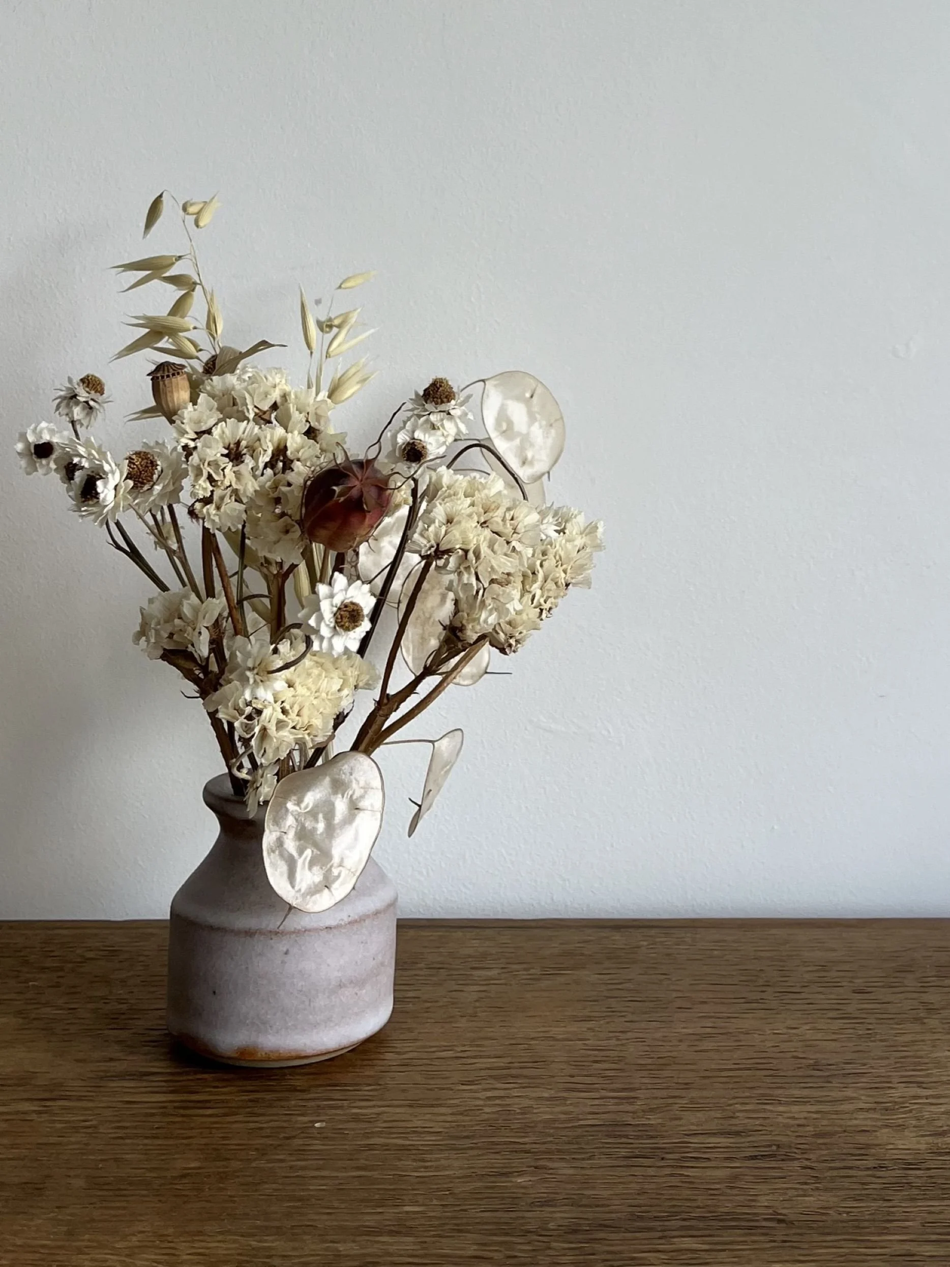 hand made stoneware bud vase with flowers