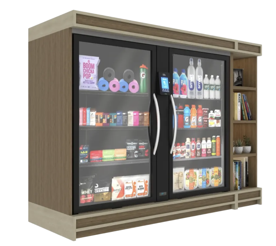 A wooden display fridge with glass doors containing beverages, snacks, and supplements, with a small bookshelf on the side. Smart Cooler, Smart Market, Smart Store