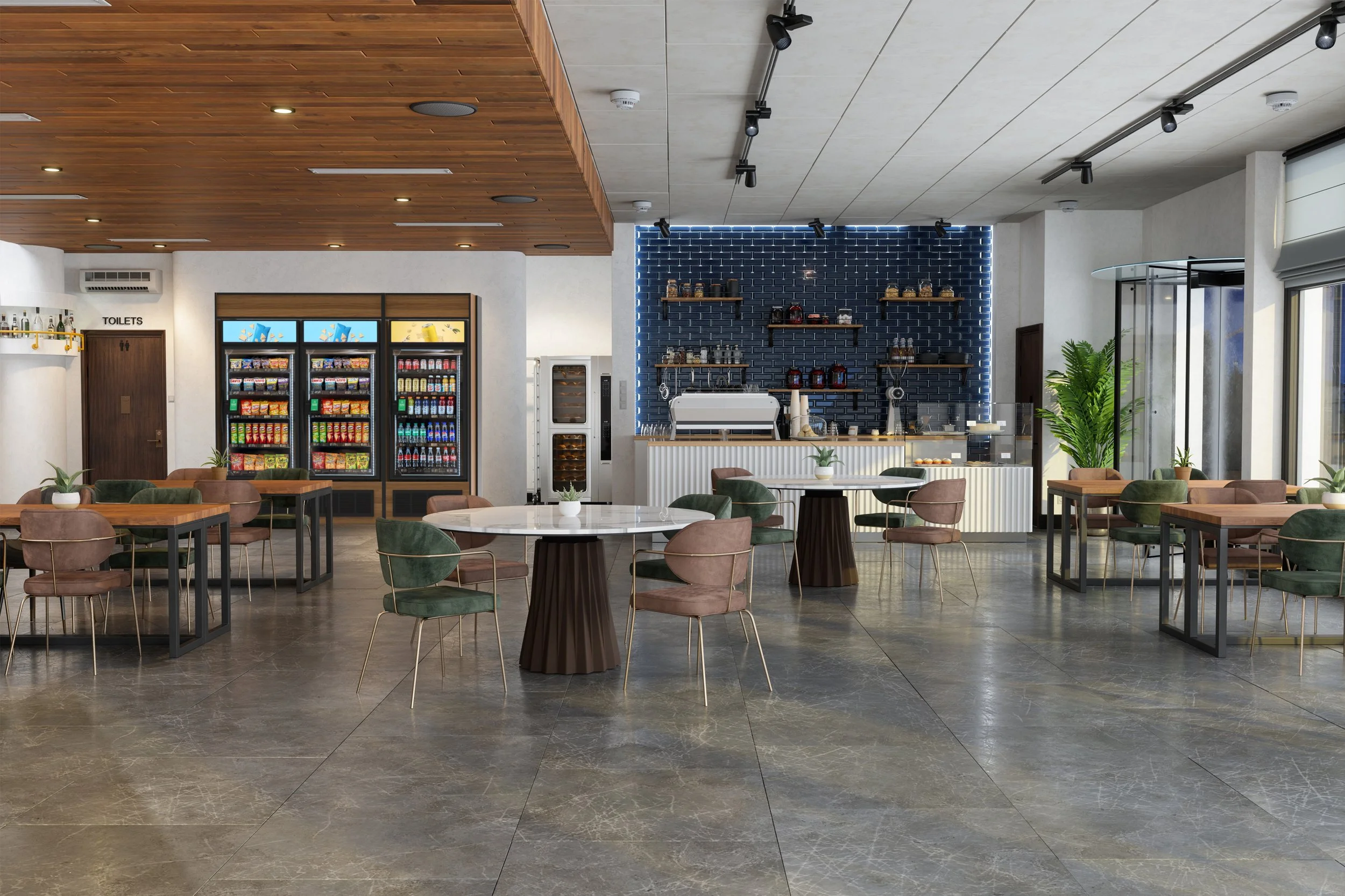 Modern cafe interior with tables and chairs, beverage vending machines, a coffee counter with equipment, and large windows with natural light.