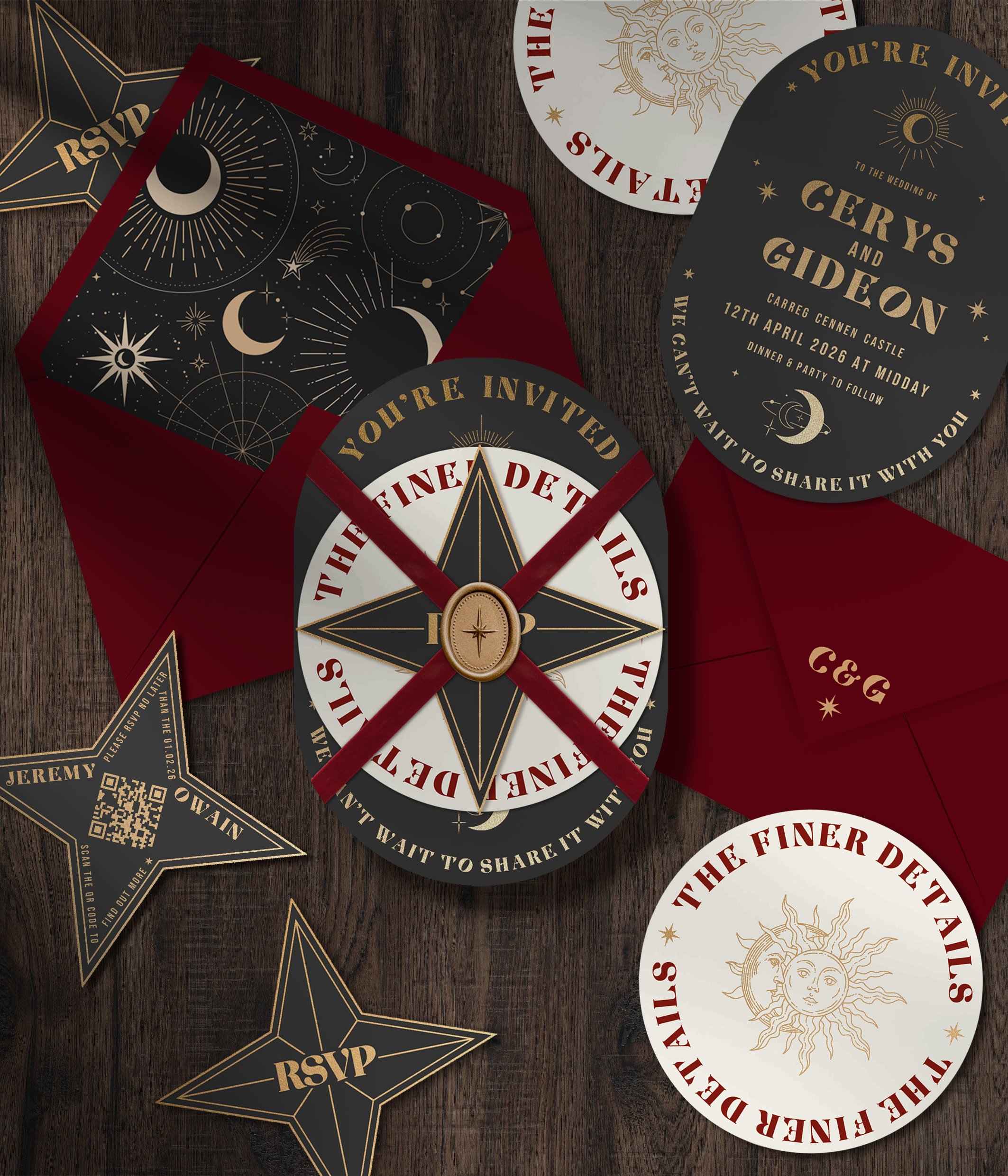 Astronomical-themed wedding invitations and RSVP cards, with celestial designs like moons and stars, set on a dark wooden surface.