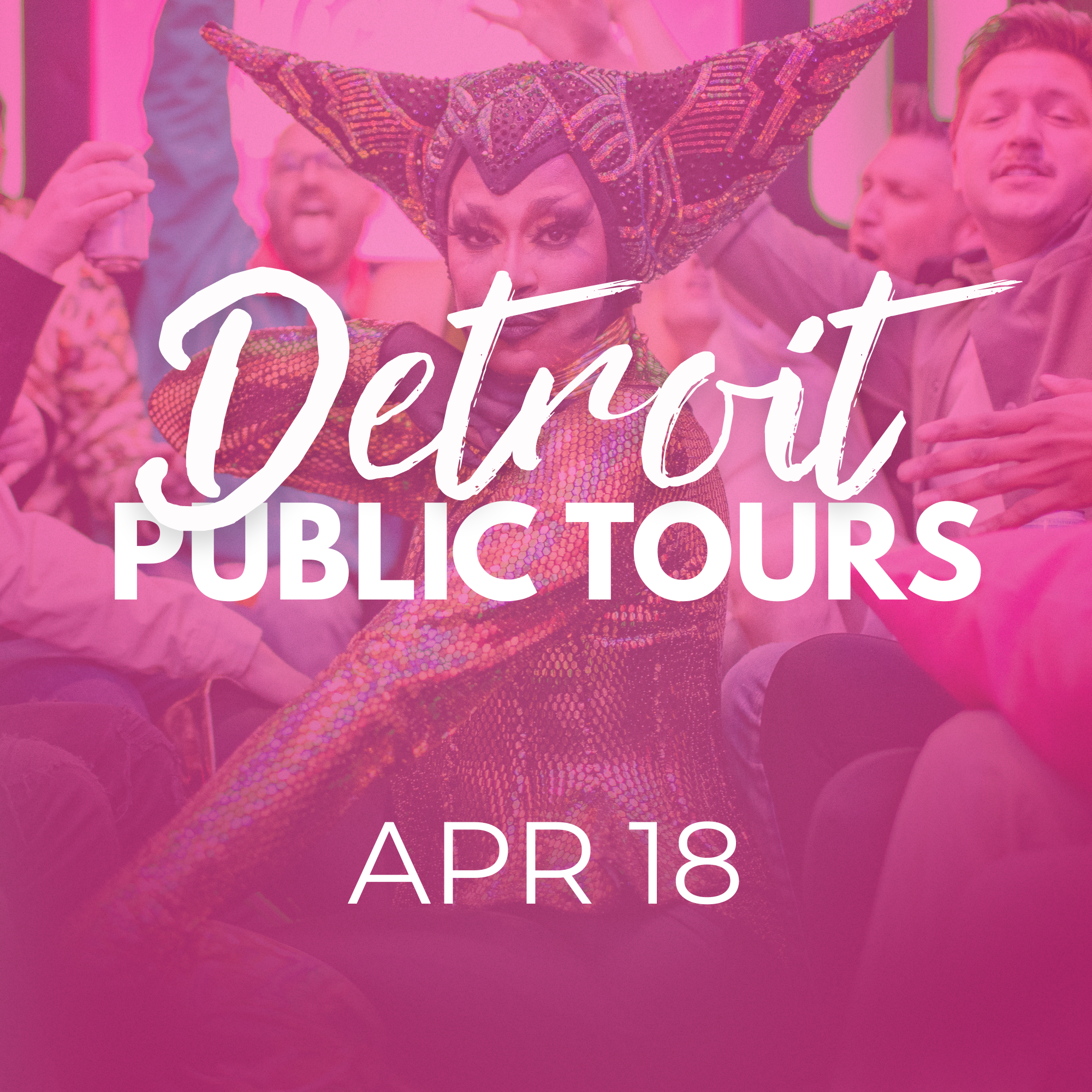 A person dressed in an elaborate, colorful costume with a large, pointed, beaded headdress, surrounded by a crowd at a public event.