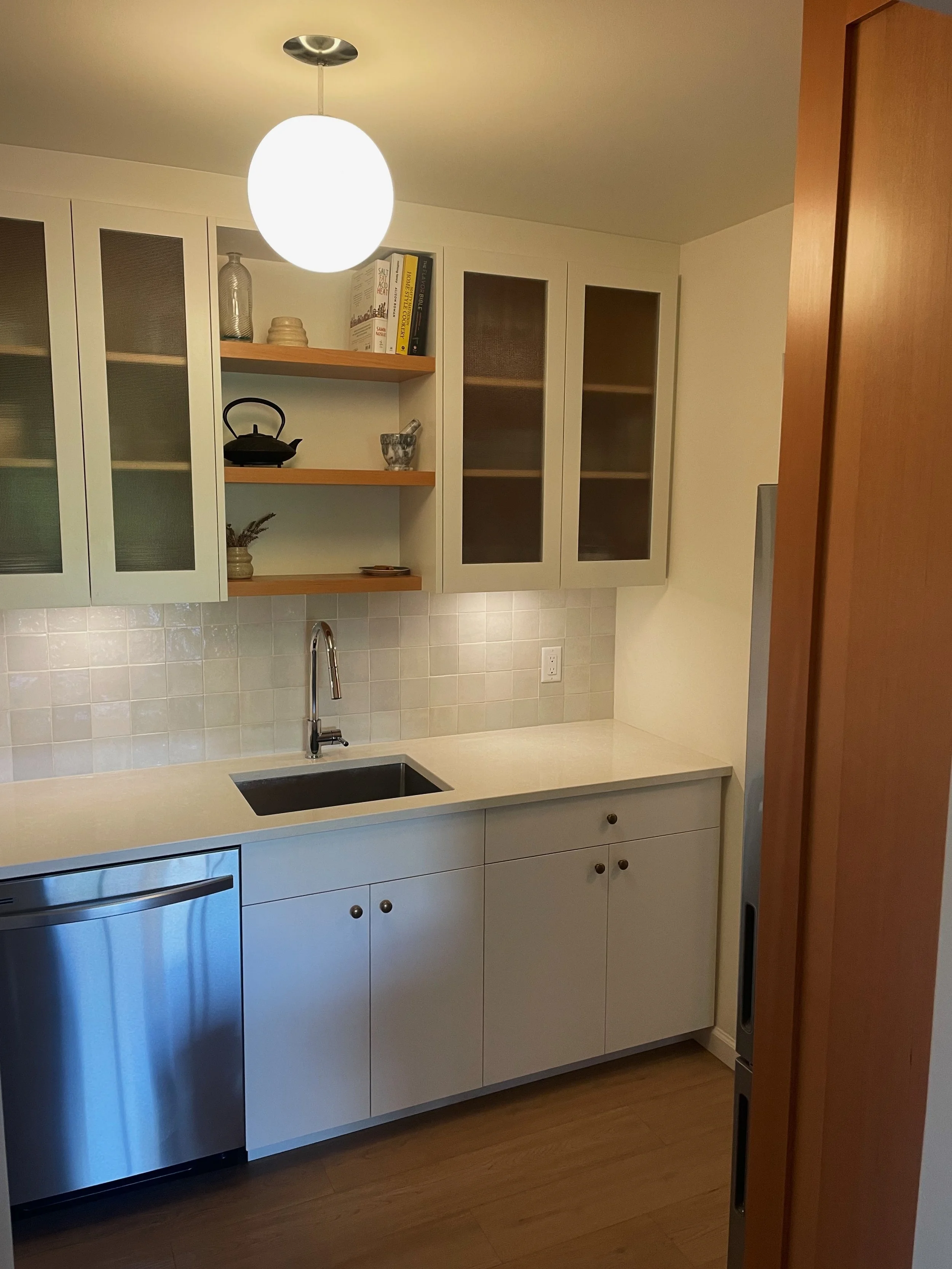 Custom kitchen renovation with custom cabinets by Herringbone Contracting