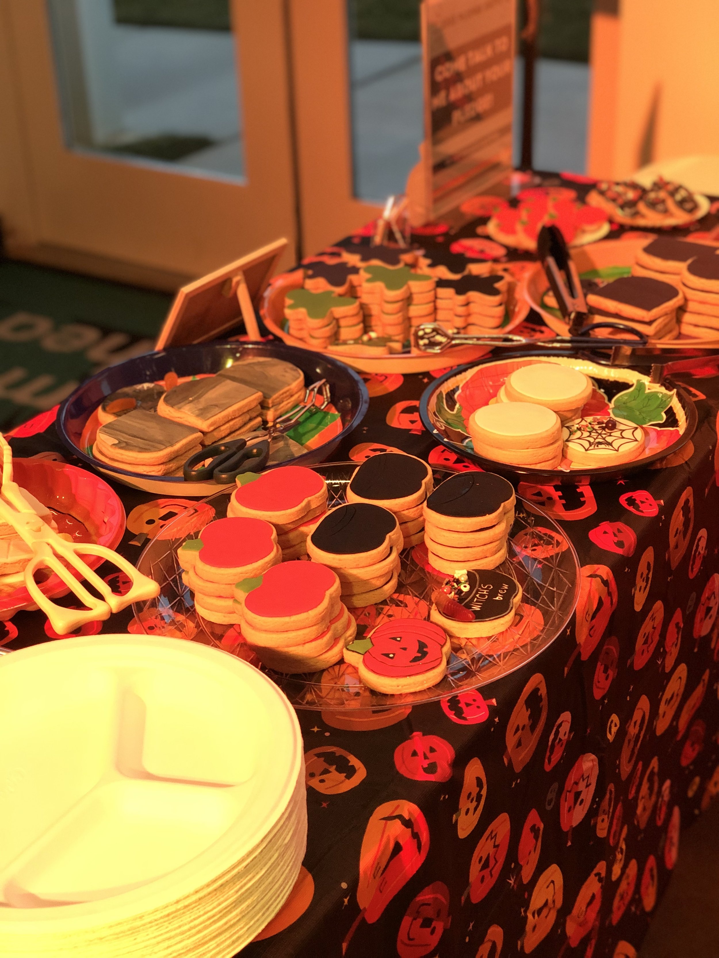 We created this DIY Halloween cookie decorating table stocked with fondant covered sugar cookies to start their creepy creations.  We equipped the table with gummy worms, sprinkles, edible paints and edible glue needed to make some spooky sweets.