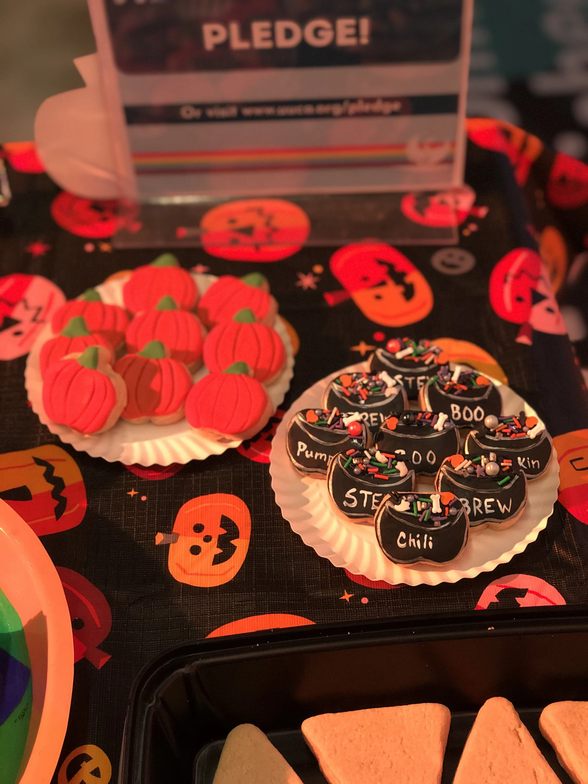The mini pumpkin and witch's cauldron decorated sugar cookies were the perfect sweet giveaway for a DIY cookie decorating party for those too shy to decorate. 