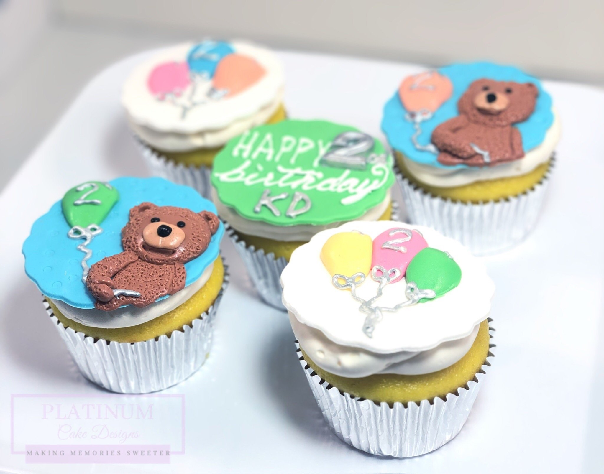 Platinum Cake Designs created these sweet bear cupcakes for a little 2 year old's birthday.  We sculpted little fuzzy bears based on his favorite stuffed animal, and we added a few little birthday balloons.