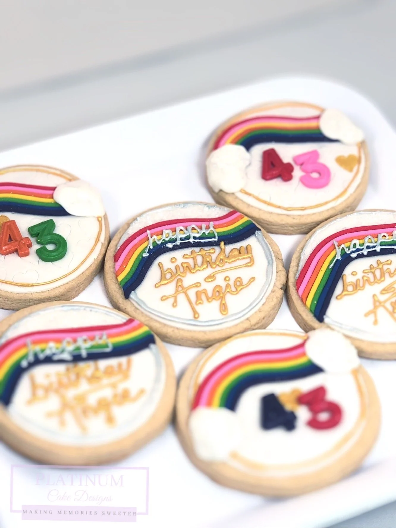 Platinum Cake Designs created these cheerful birthday sugar cookies for this client's 45th birthday.  As a child they loved Care Bears, so we recreated Cheer Bear Care Bear on their custom cookies with a hand painted inscription.