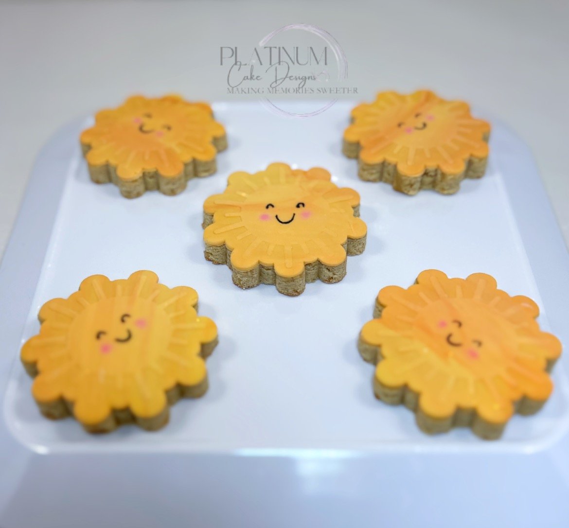 We created these custom sugar cookies for an Assistant Principal spreading a little sunshine for parents and students.  We marbled the design and used an embosser to create the sunrays to add depth to the cookies.