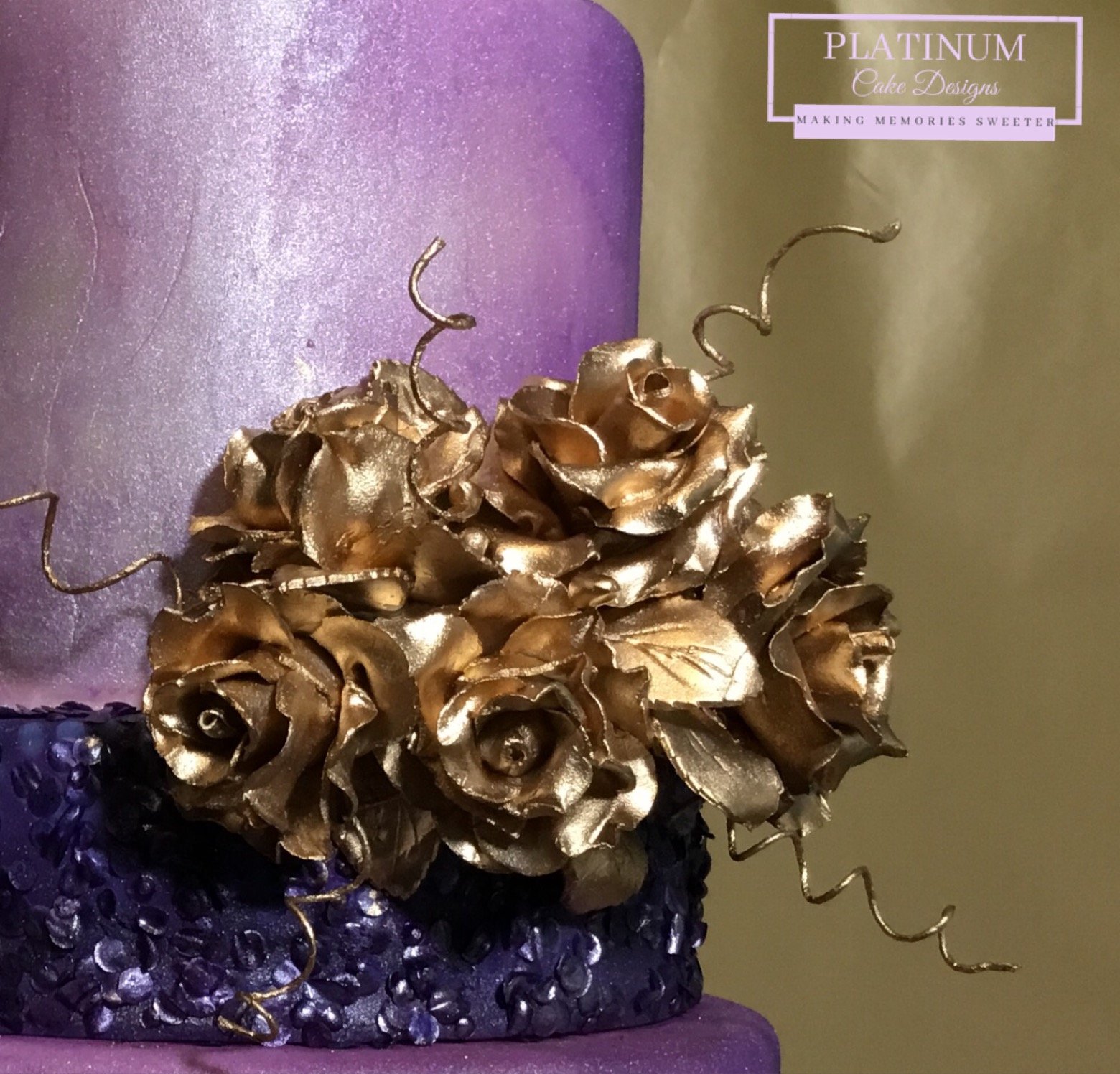4-tier purple ombre wedding cake with gold flowers closeup.JPG