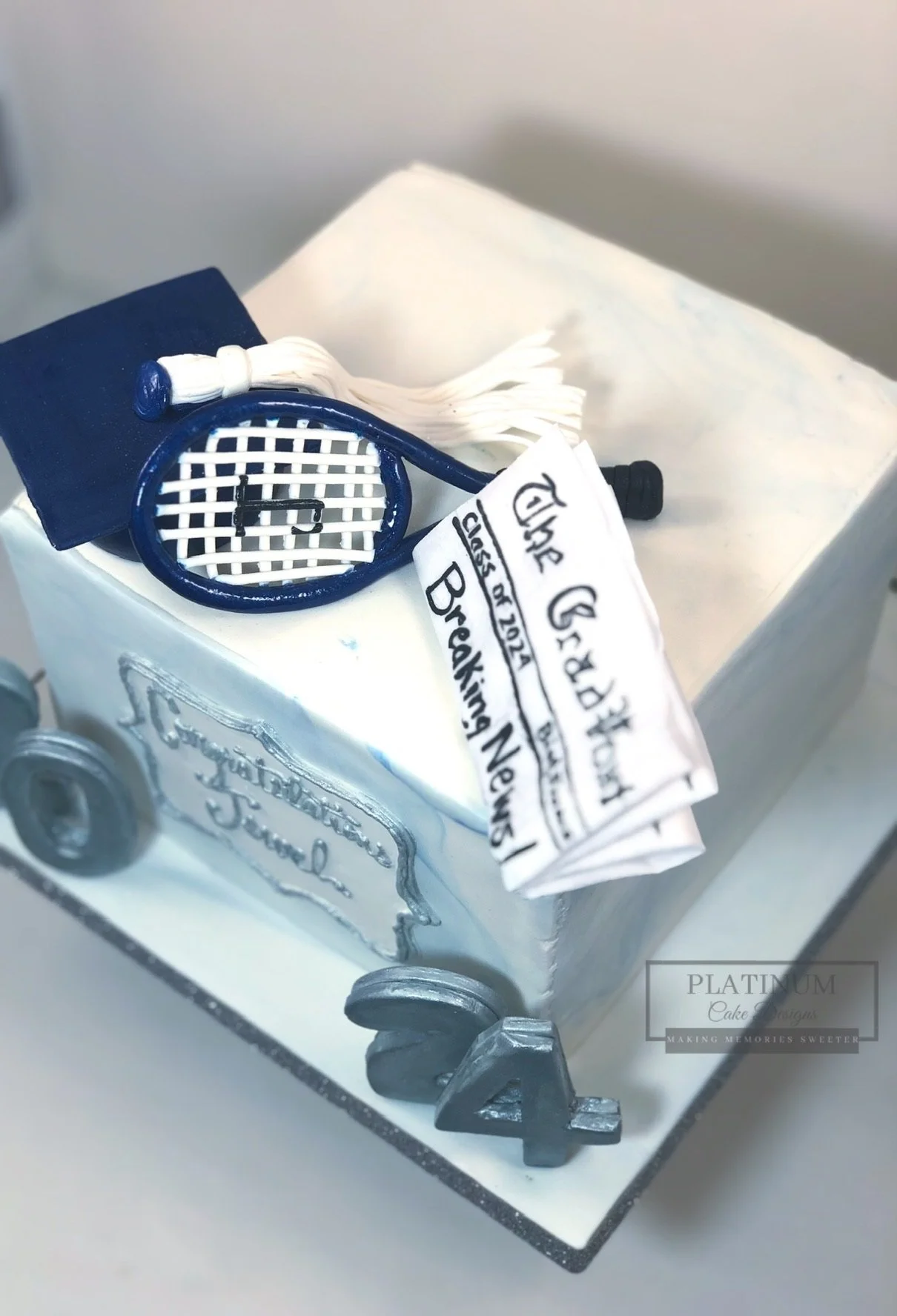 Graduation cake tennis journalist theme top.JPG