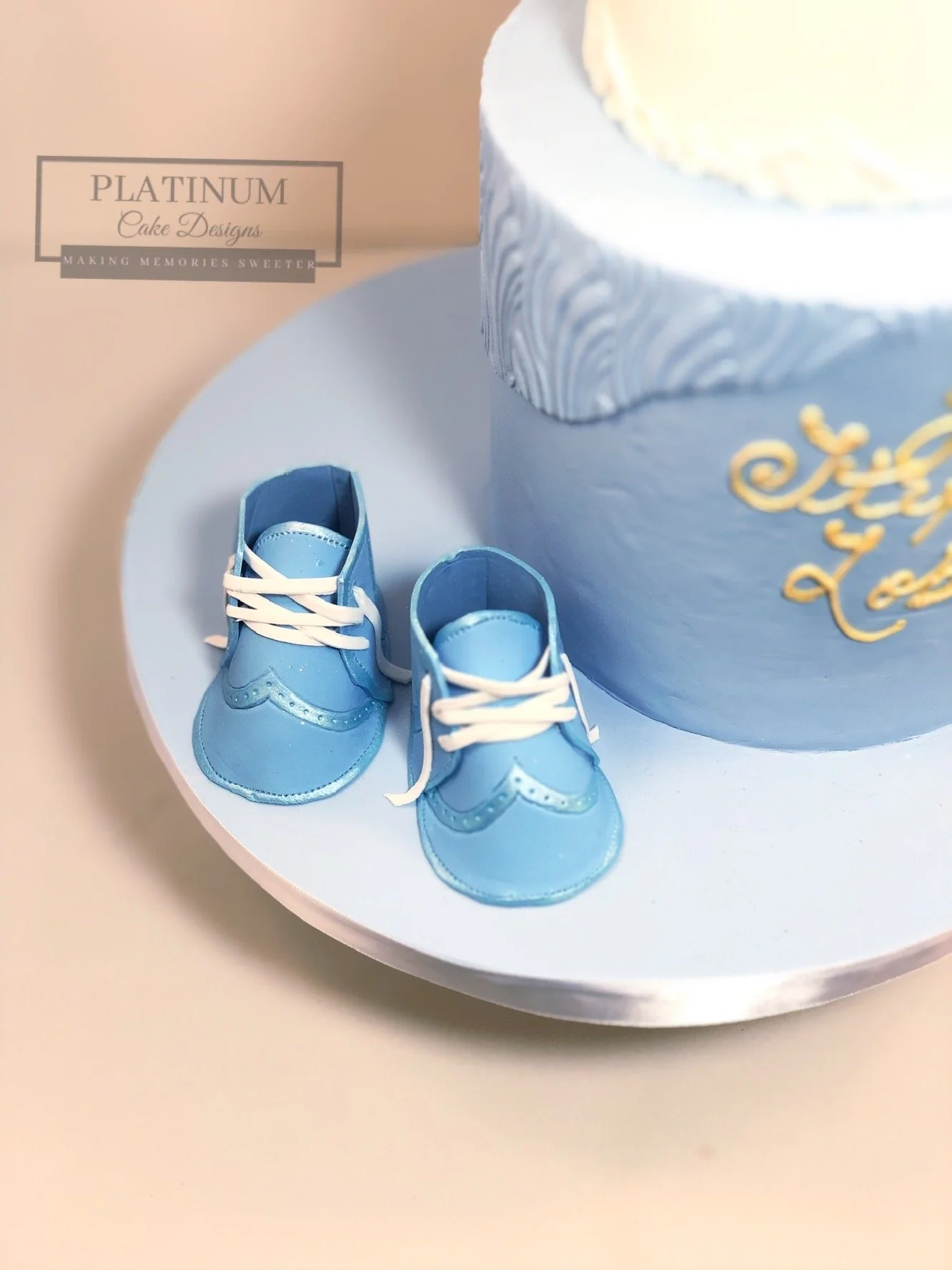 2-tiered blue Baptism Cake closeup baby shoes.JPG