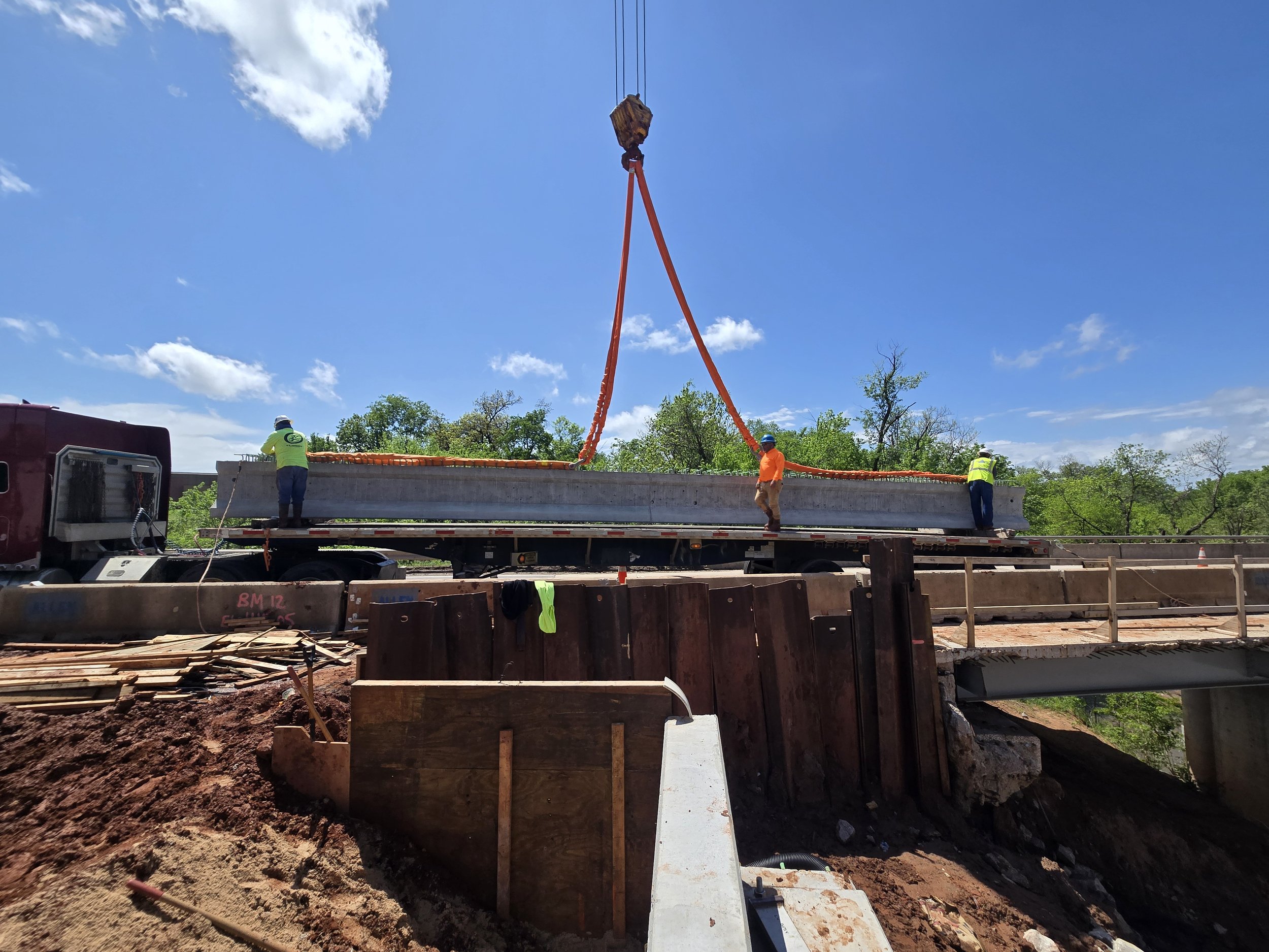Setting beams on hwy 9 in Norman