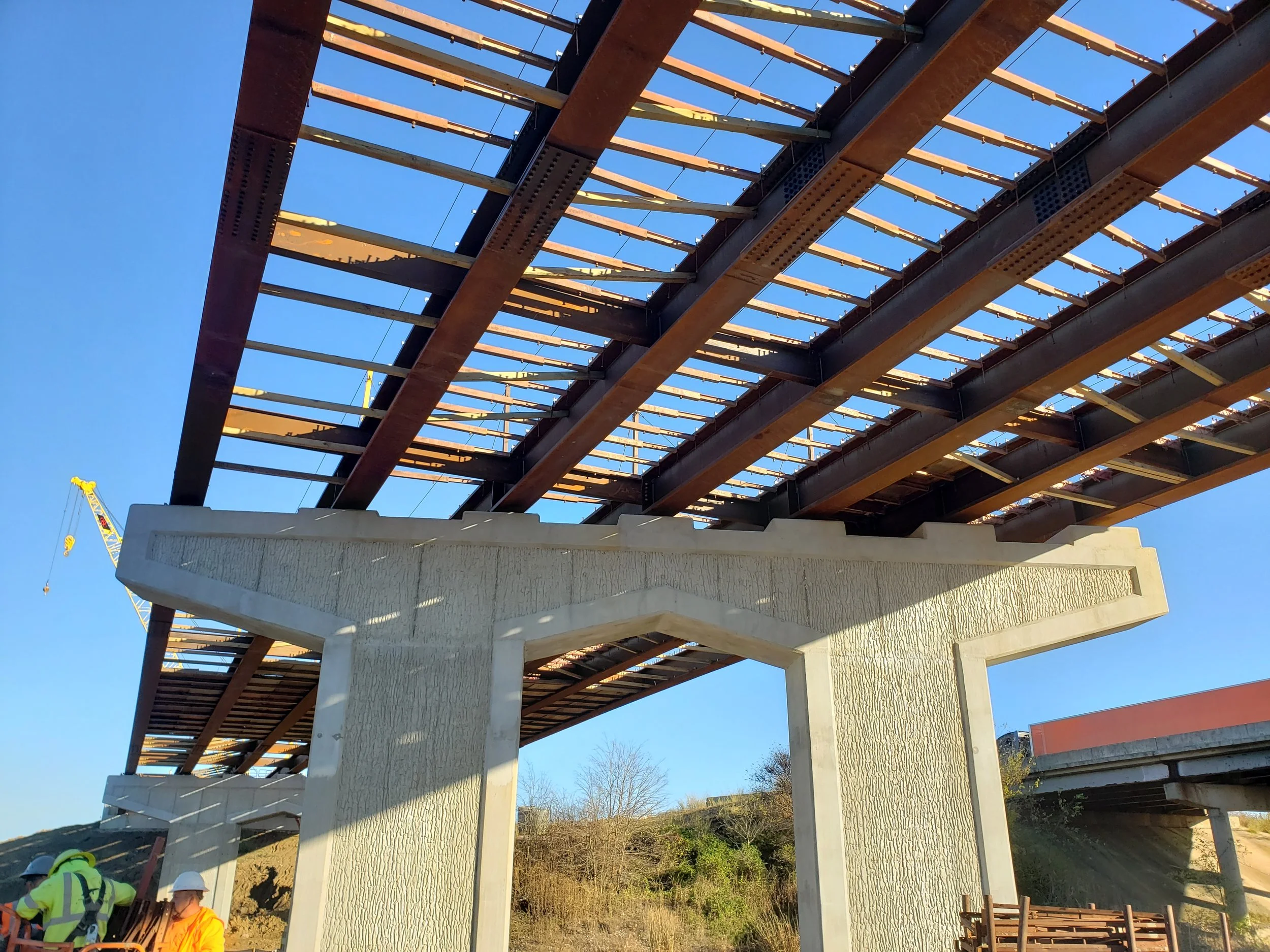 Bridge with Metal beams views from below, 4x4 engineered design to keep spacing correct for metal decking placement