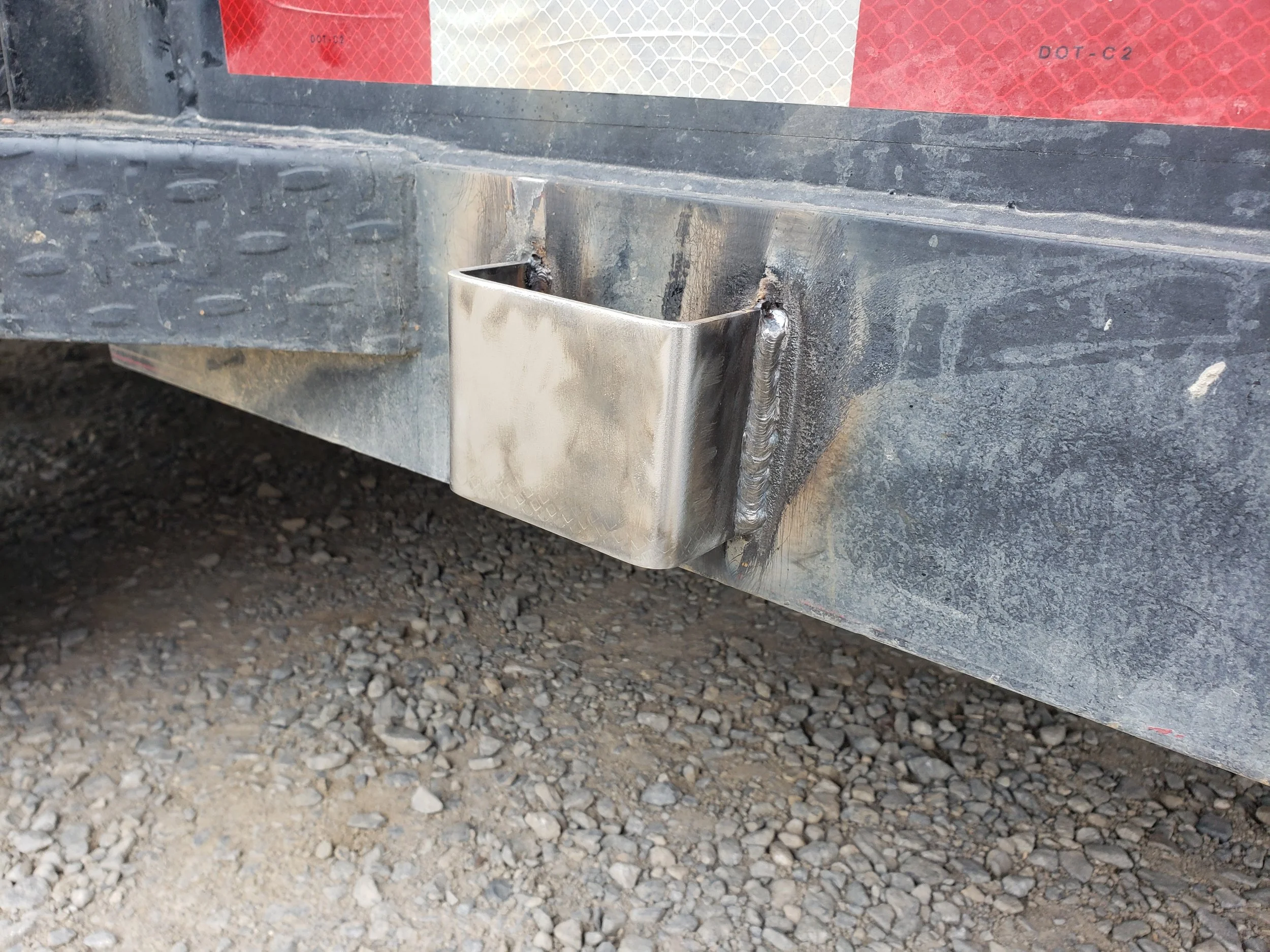 close up of new anchor points being welded on grailer