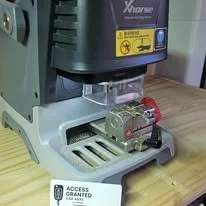 Laboratory instrument on a wooden surface with a tag that says 'Access Granted' in front of it.