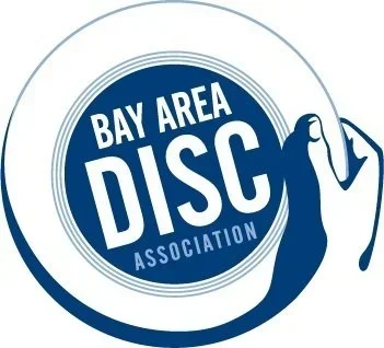 Logo of the Bay Area Disc Association featuring a stylized female figure holding a disc.