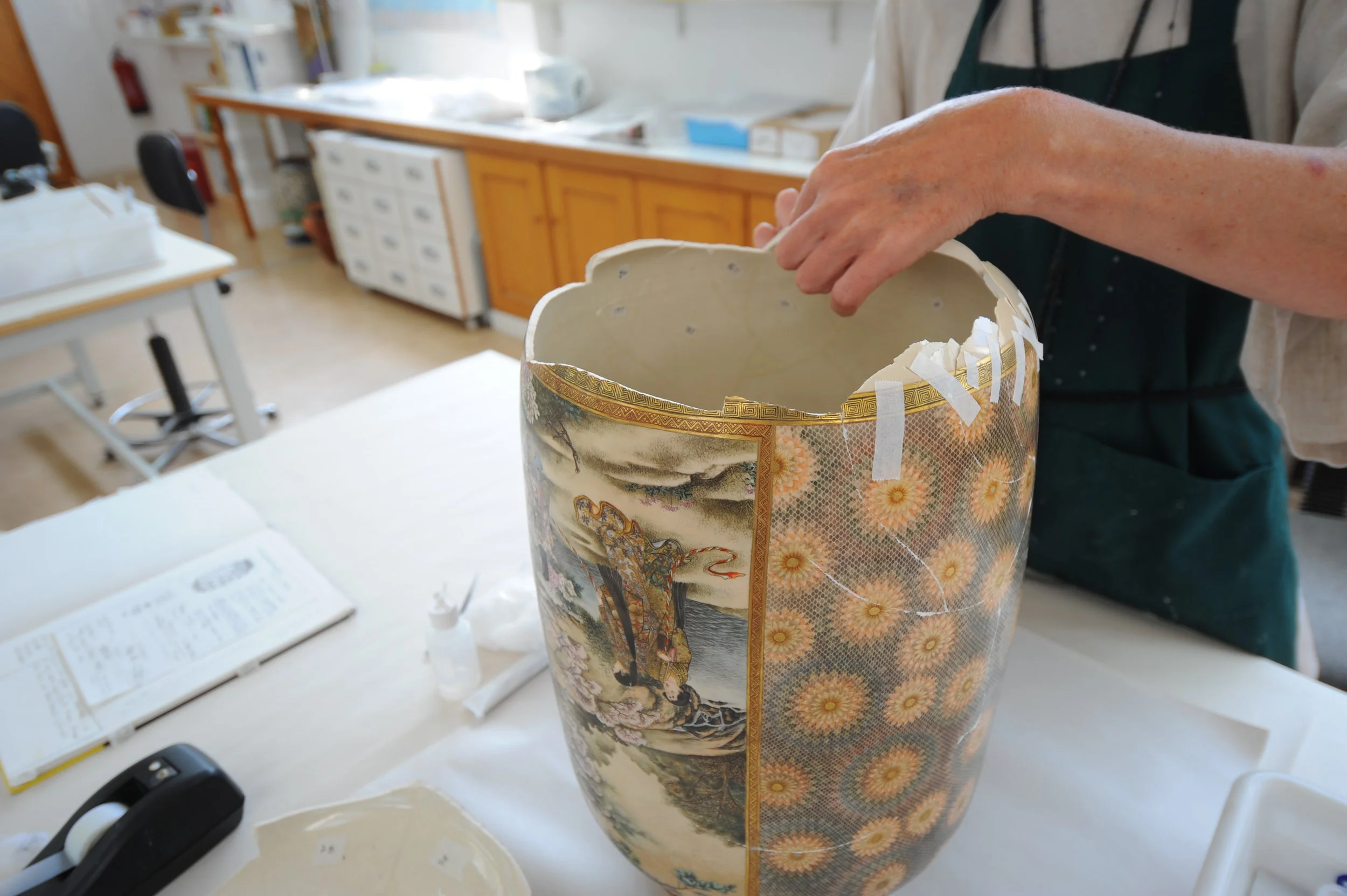 WIP, bonding the over 75 fragments with the help of a visiting conservator. 