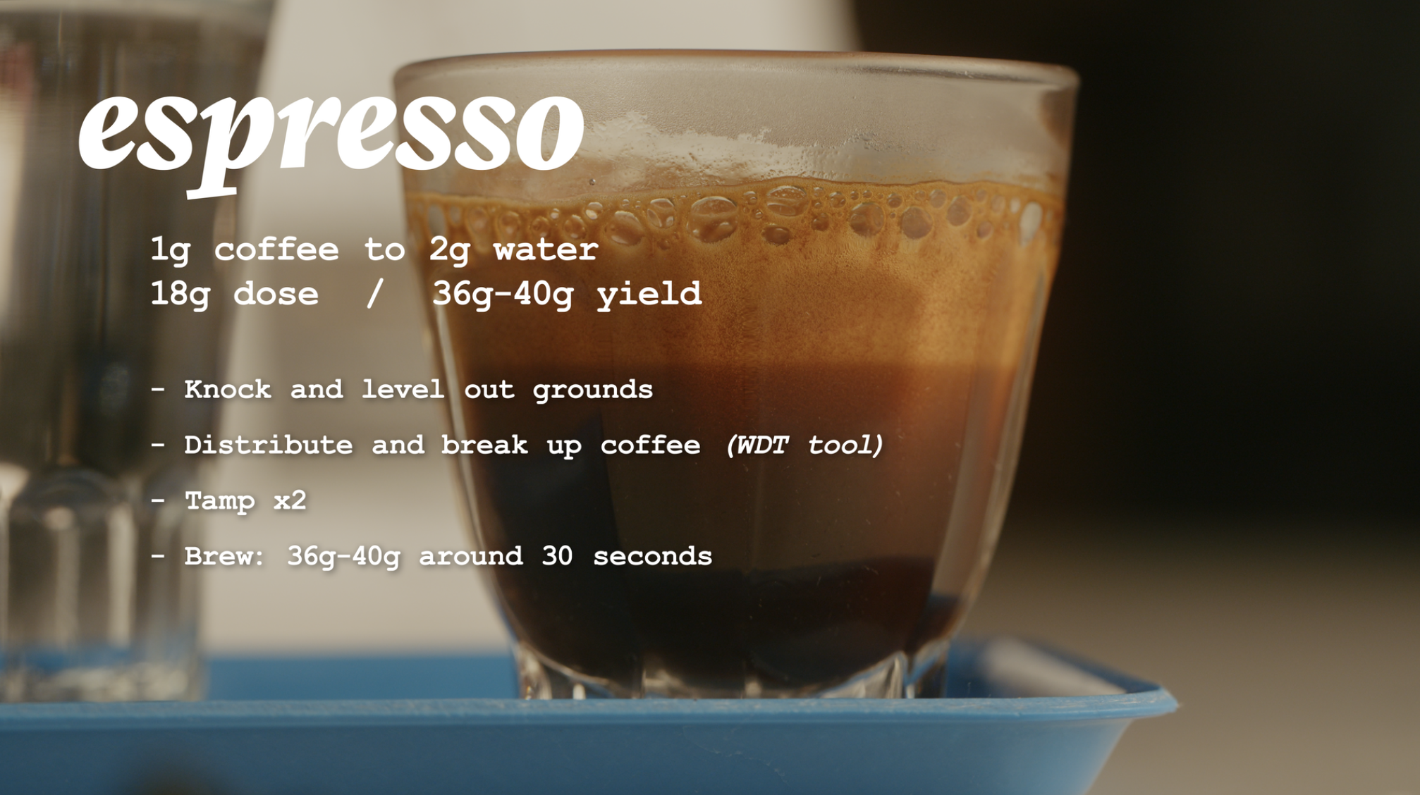 Close-up of a glass of espresso with informational overlay about brewing instructions, including coffee to water ratio, dose, yield, and steps for preparation.