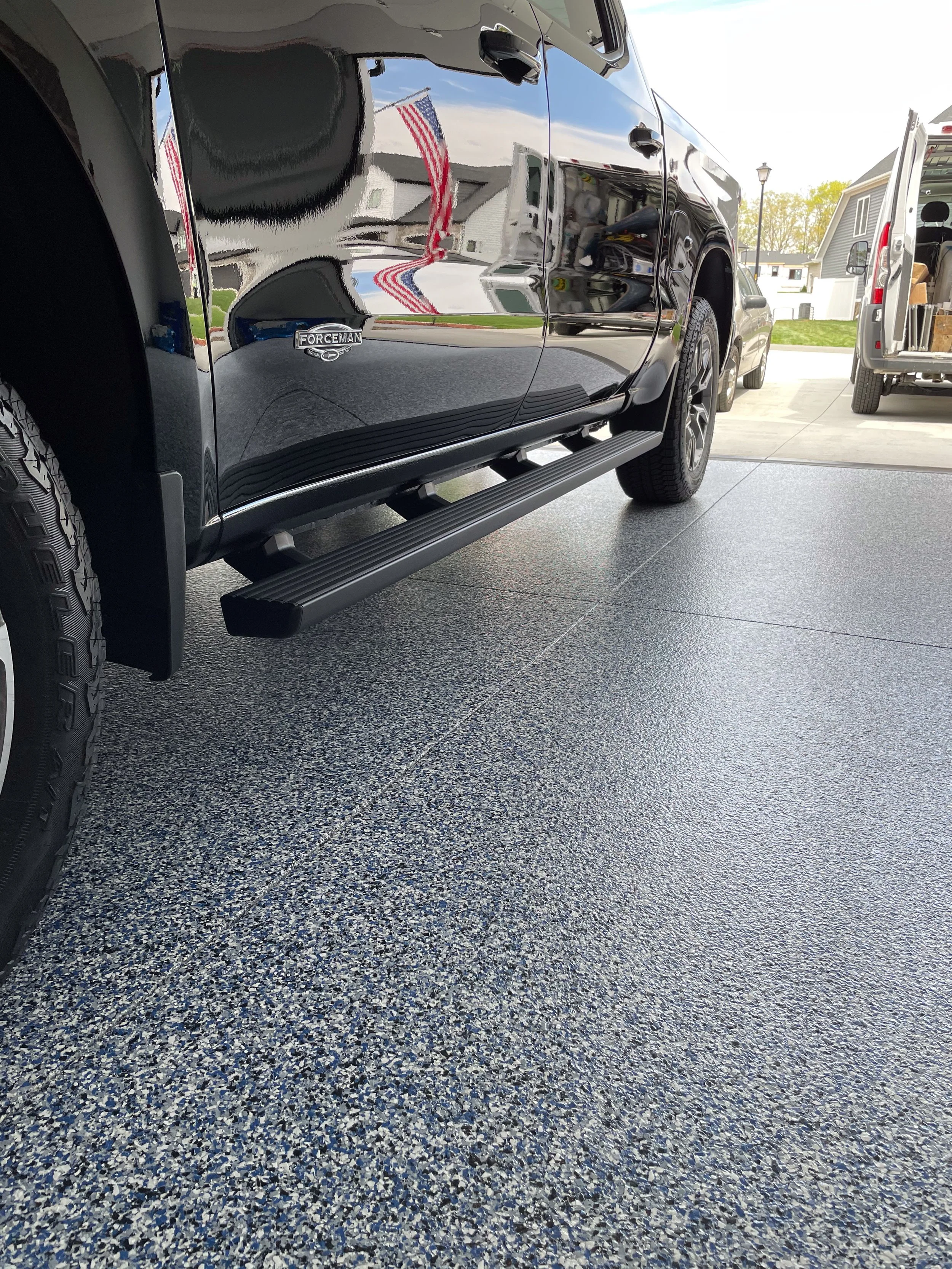 Full-flake epoxy garage floor with gray and white flake blend installed in Wichita, Kansas.