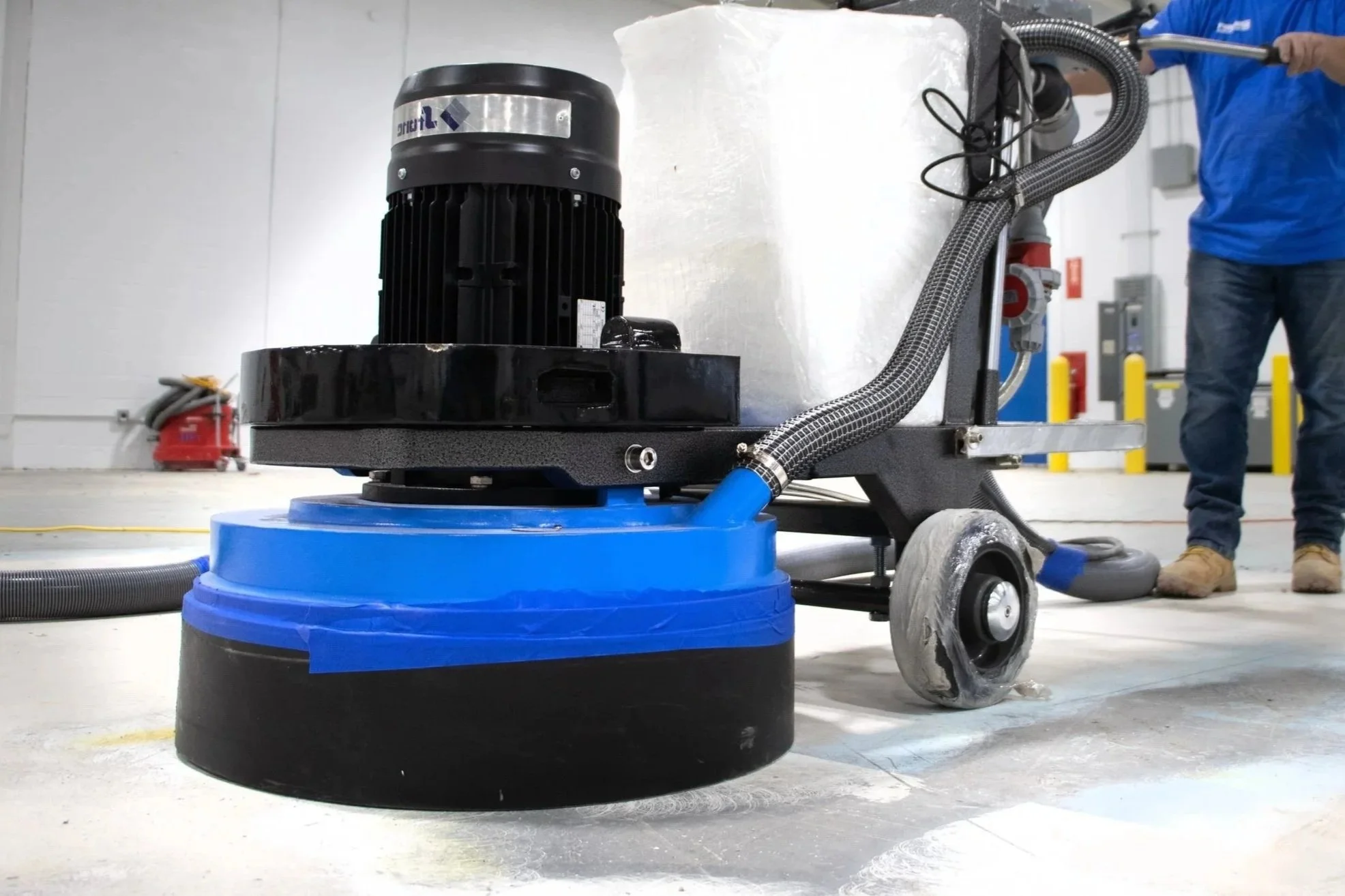 “Finished epoxy garage floor with gray flake system and smooth polyaspartic topcoat.”