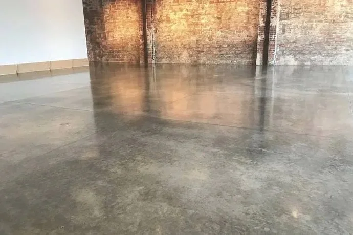 Seamless gray commercial epoxy floor coating installed in a retail or office space in Wichita, KS.