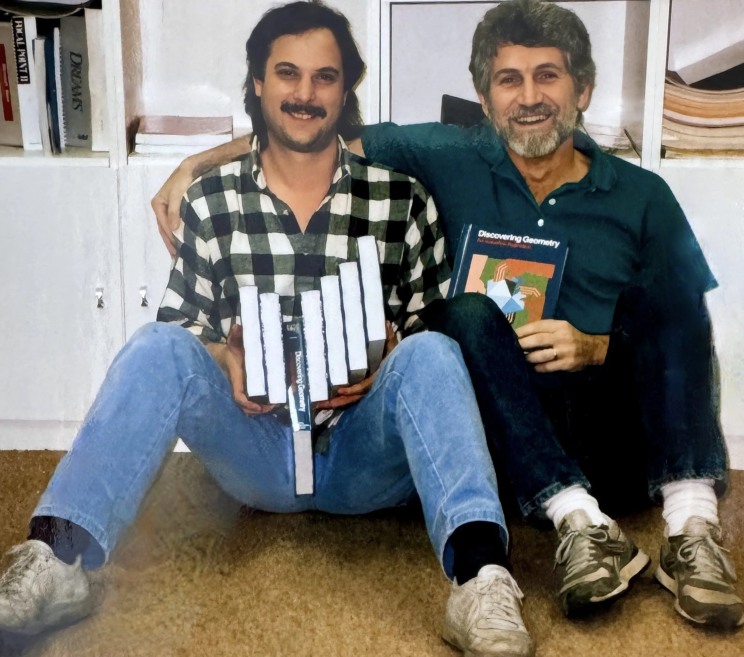 Steve and Michael with the first edition of Discovering Geometry