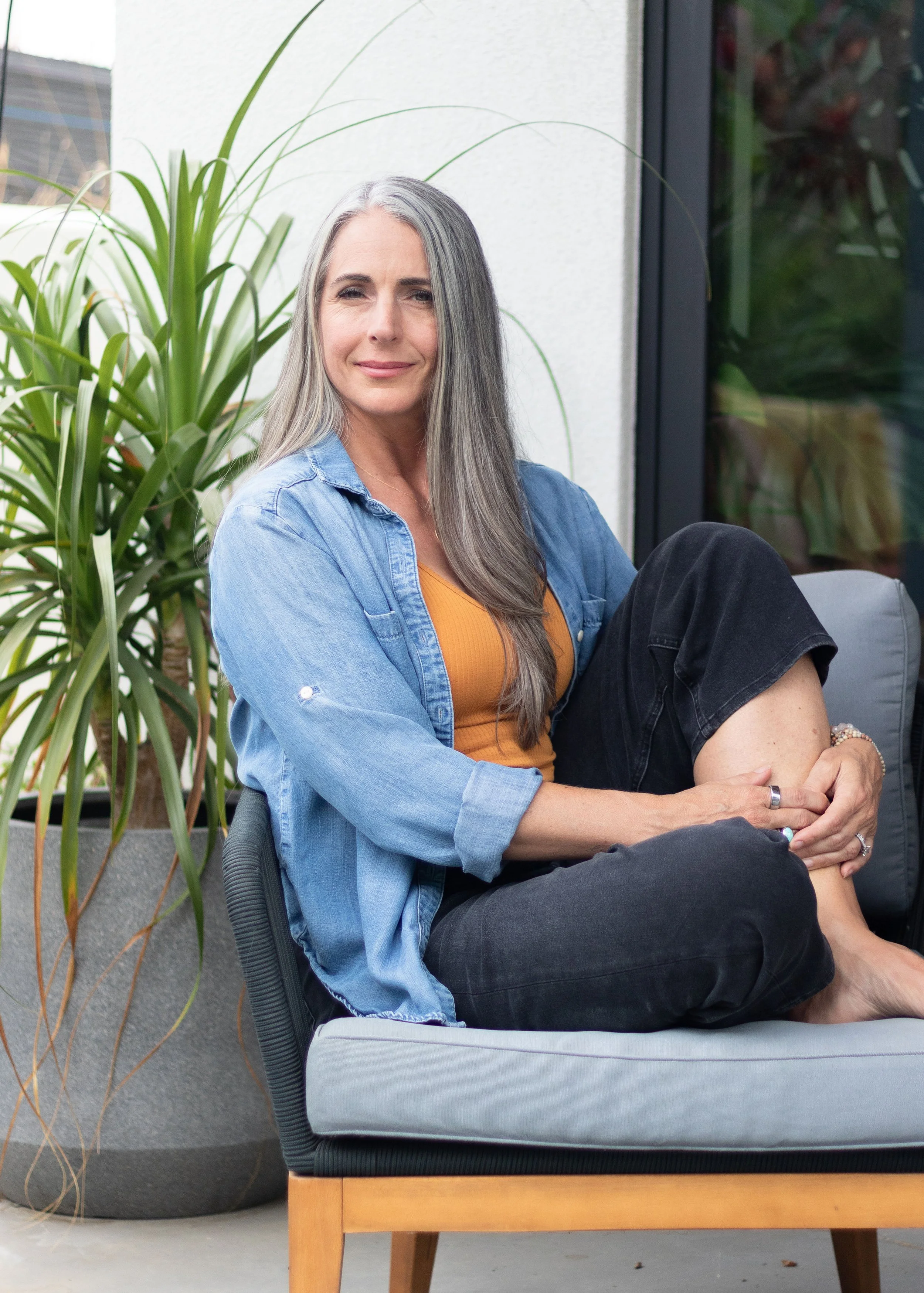 Jenn Sabo sitting My Spiritual Speakeasy