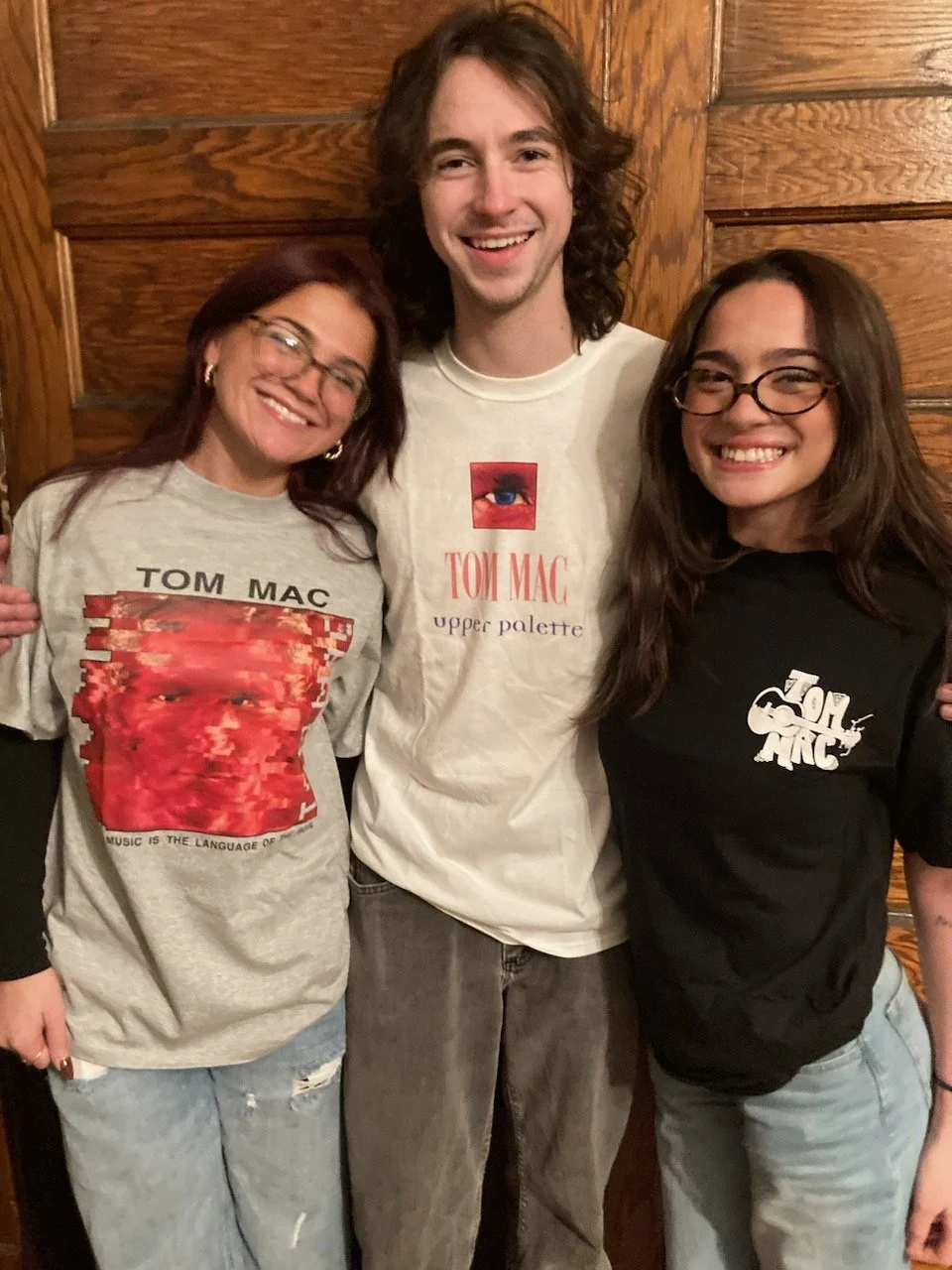 Wearing Tom Mac Group T-shirts. TMG Merch is here!