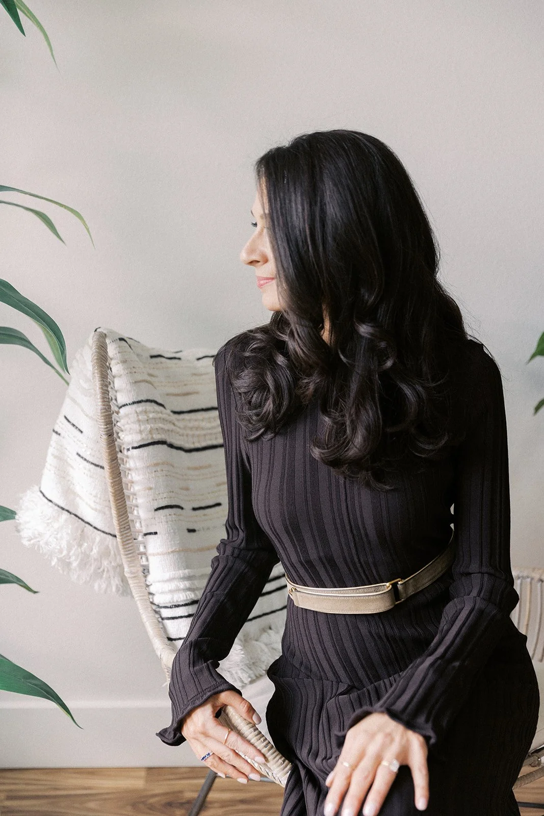 Women Looking out a window taking a pause to think