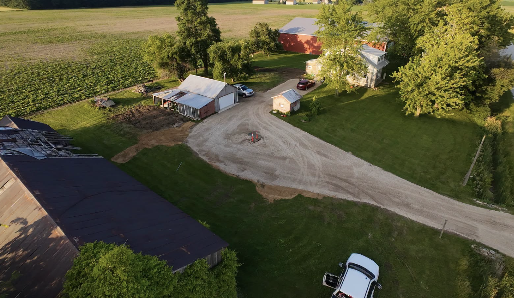 Pole barn site preparation completed in Almont, MI, including excavation, grading, and land leveling.