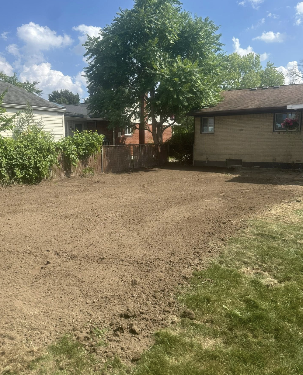 Land clearing and grading project completed in Troy, MI, preparing the property for residential development.
