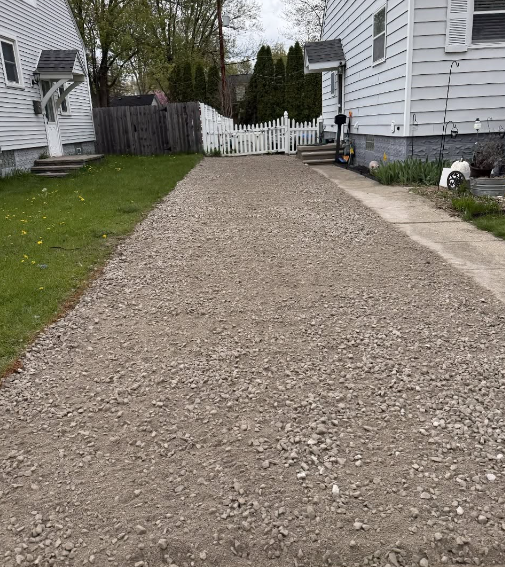 Completed gravel driveway installation featuring professional grading, excavation, and a durable finished surface by Elite Excavating in Southeast Michigan.