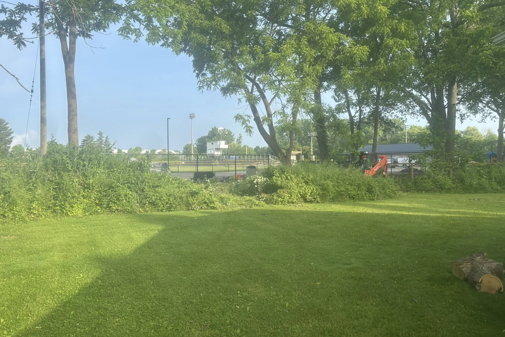 Precision grading and land leveling services completed in Lapeer, MI, creating a stable foundation and improving drainage.