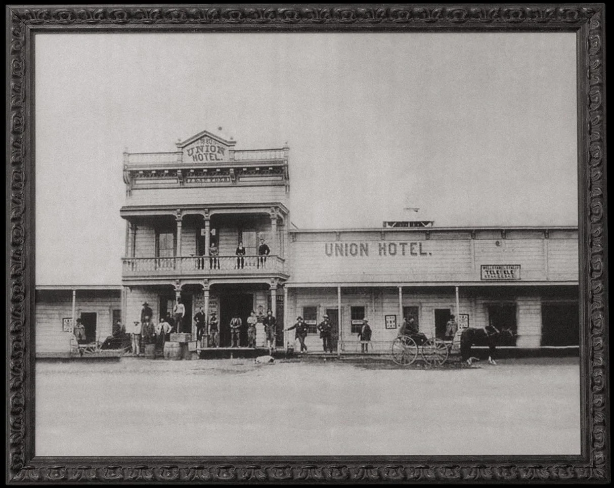 Historic black-and-white photo of the Union Hotel's original facade, in an ornate frame