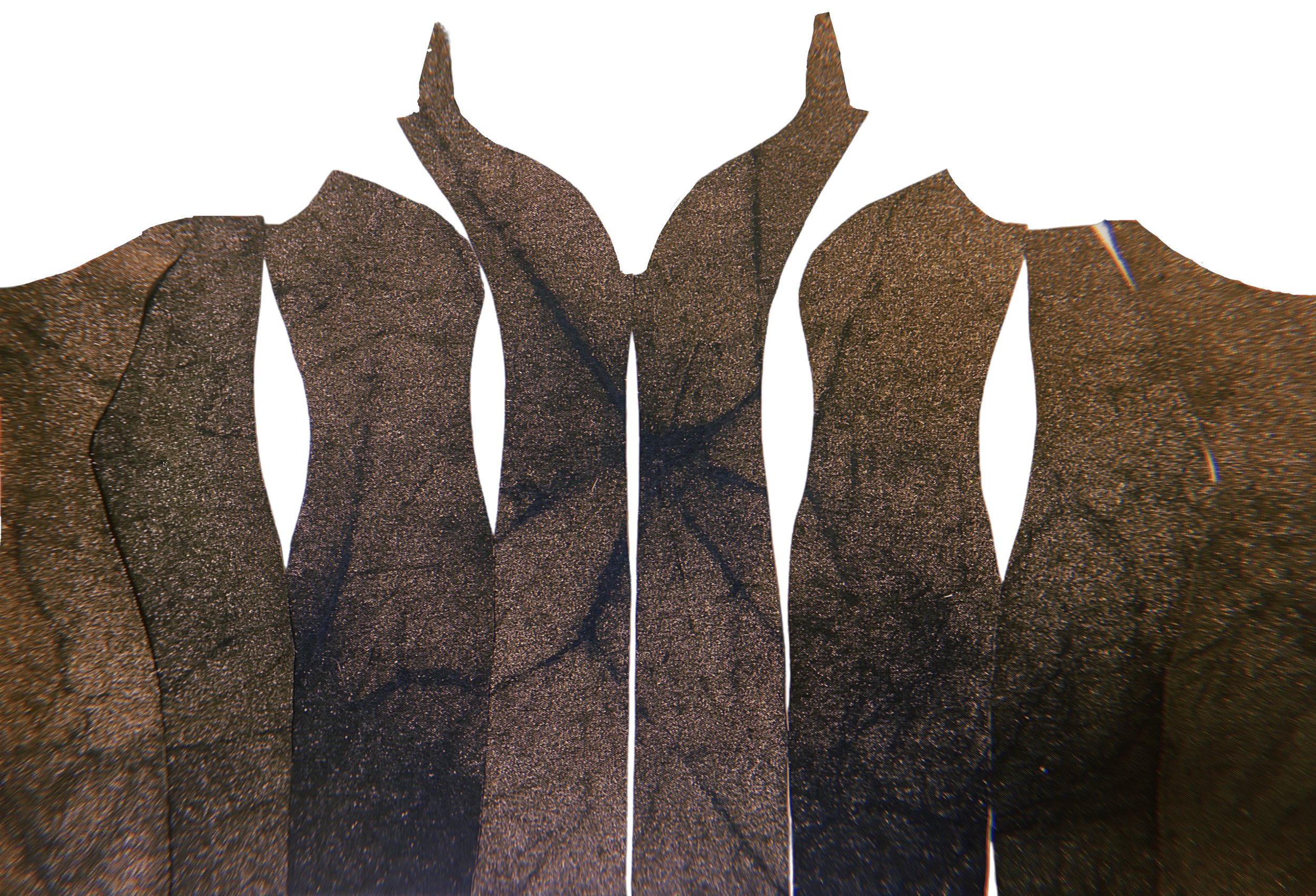 Close-up of dark brown wooden pieces with visible cracks, arranged in a row with some gaps between them.