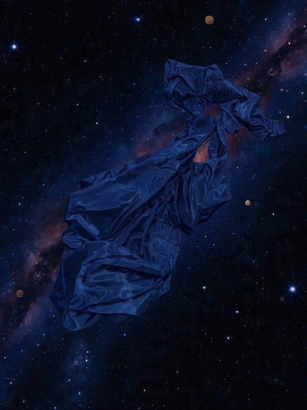 A crumpled blue satin dress floating in space with stars and planets in the background.