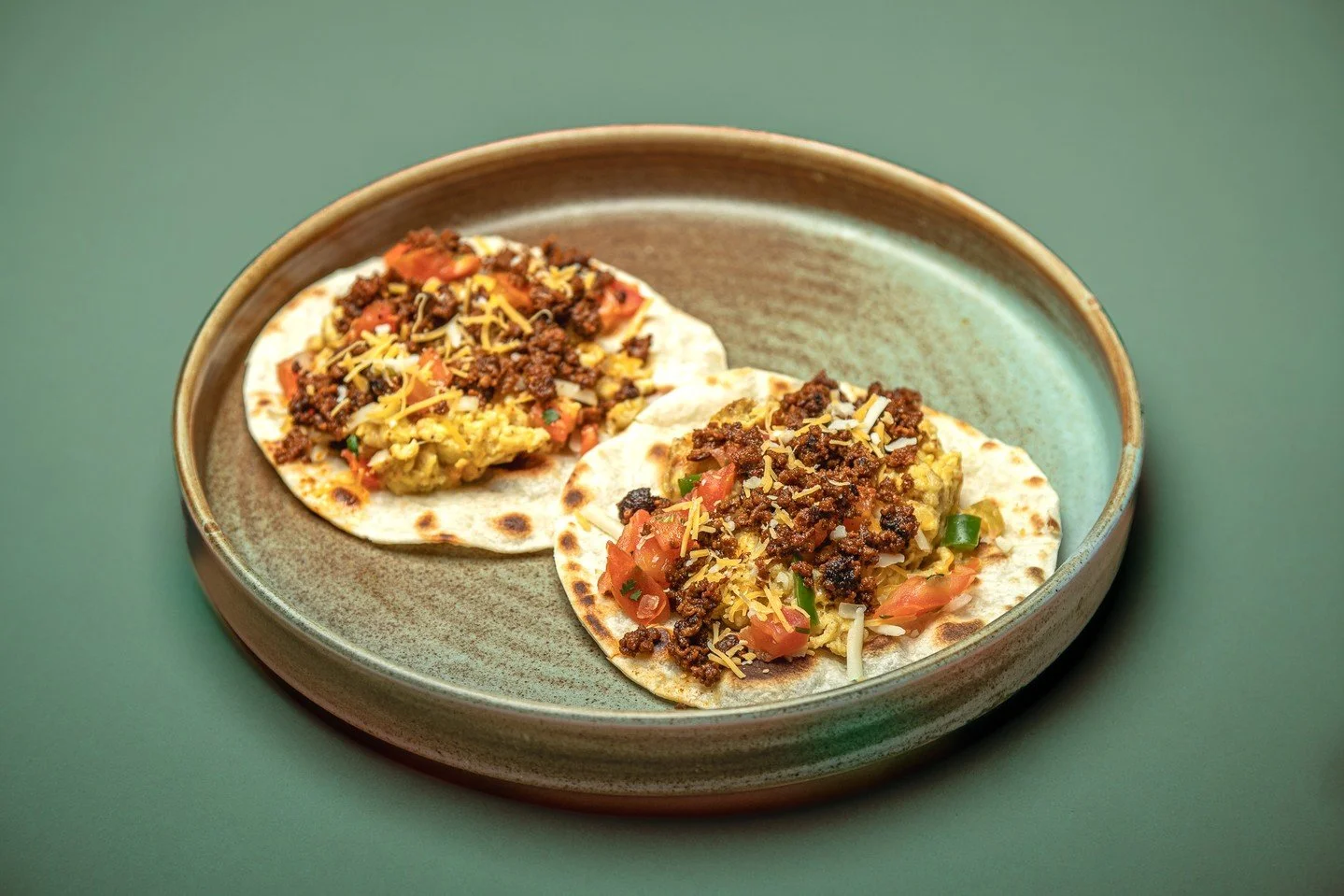 Chorizo &amp; egg on a fire-blistered tortilla. Salsa verde, cotija, cilantro. This is how mornings should taste. 🔥🌮

Muertos Breakfast Bodega &mdash; open 7am-3pm daily
📍 Sugar House - 1215 Wilmington Ave. Suite 104

Order ahead online at muertos