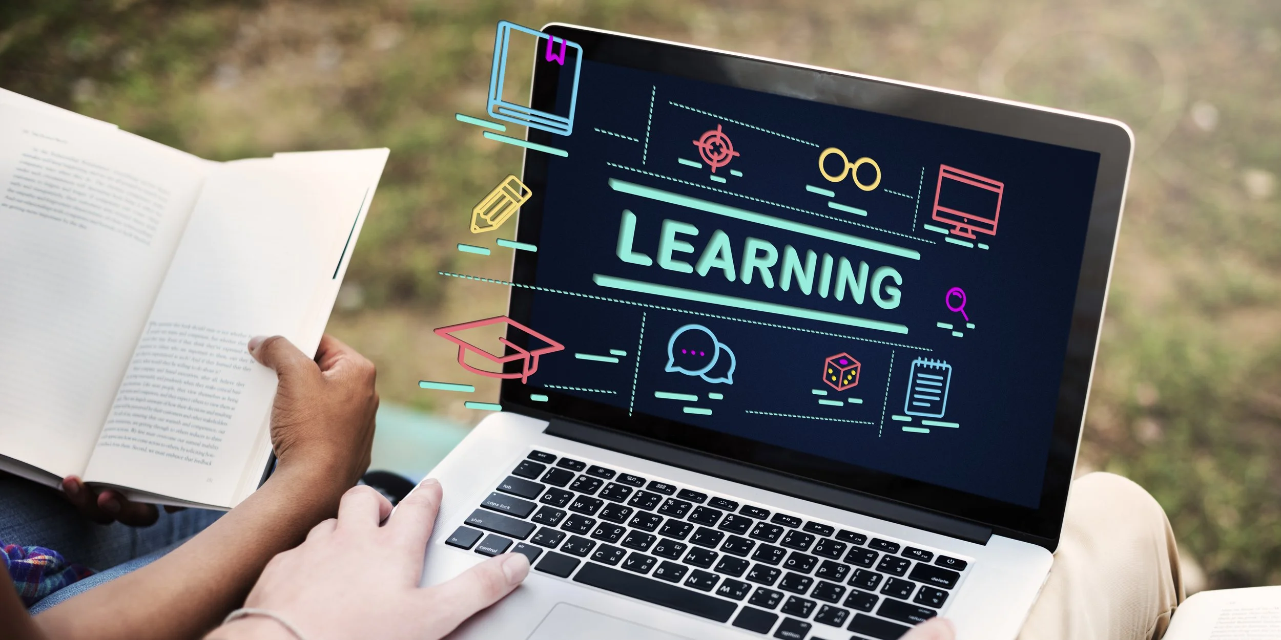 Person holding an open book next to a laptop displaying the word 'LEARNING' with colorful icons related to education and technology.