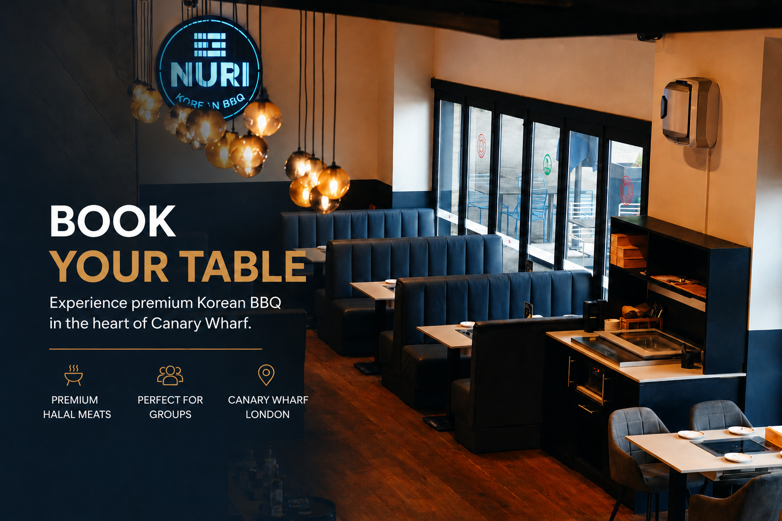 NURI Korean BBQ restaurant interior in Canary Wharf, London, featuring modern booth seating, warm pendant lighting, premium Korean BBQ tables, and a stylish contemporary dining atmosphere.