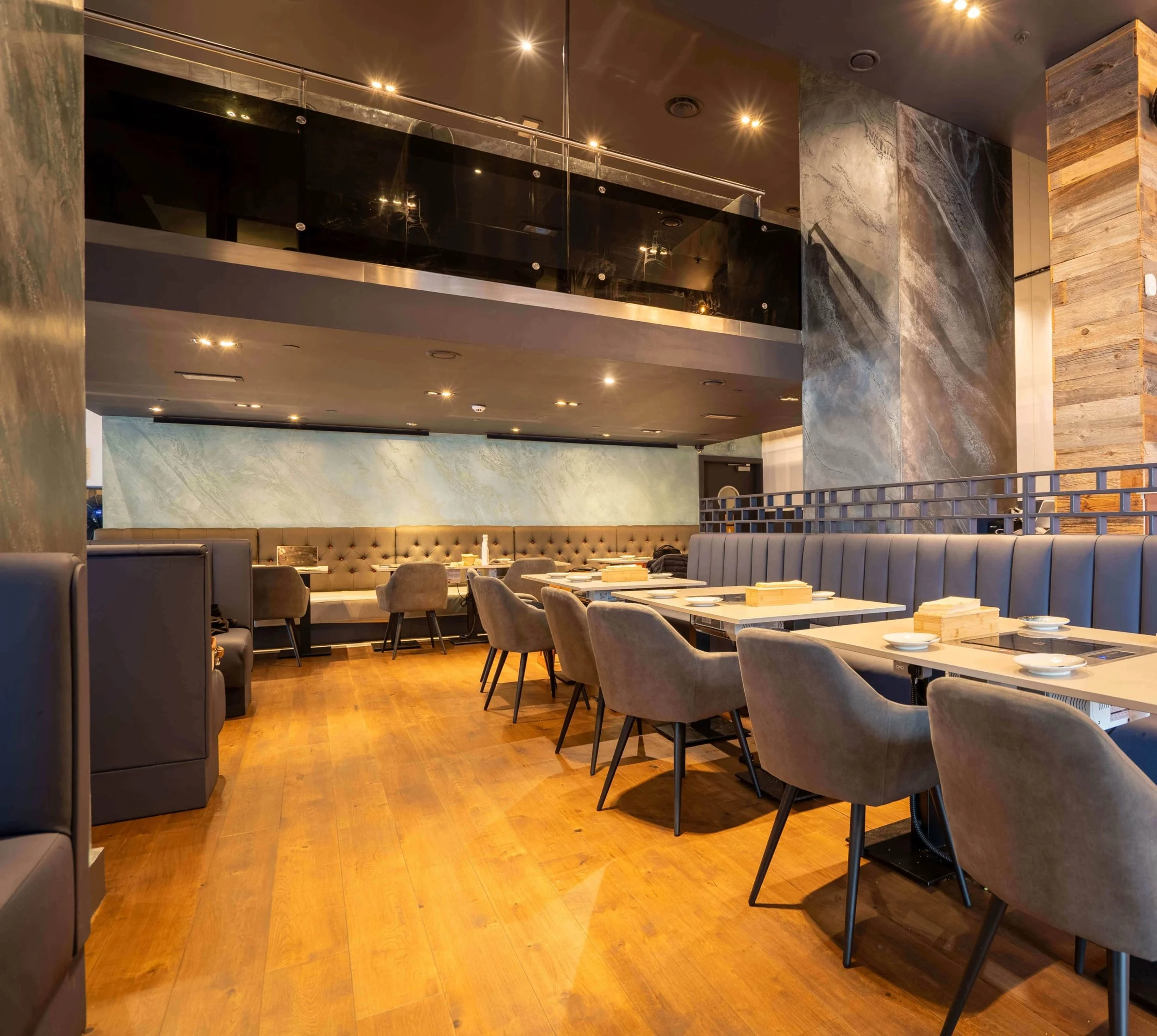 Spacious group dining interior at Nuri Korean BBQ, ideal for corporate events in Canary Wharf.