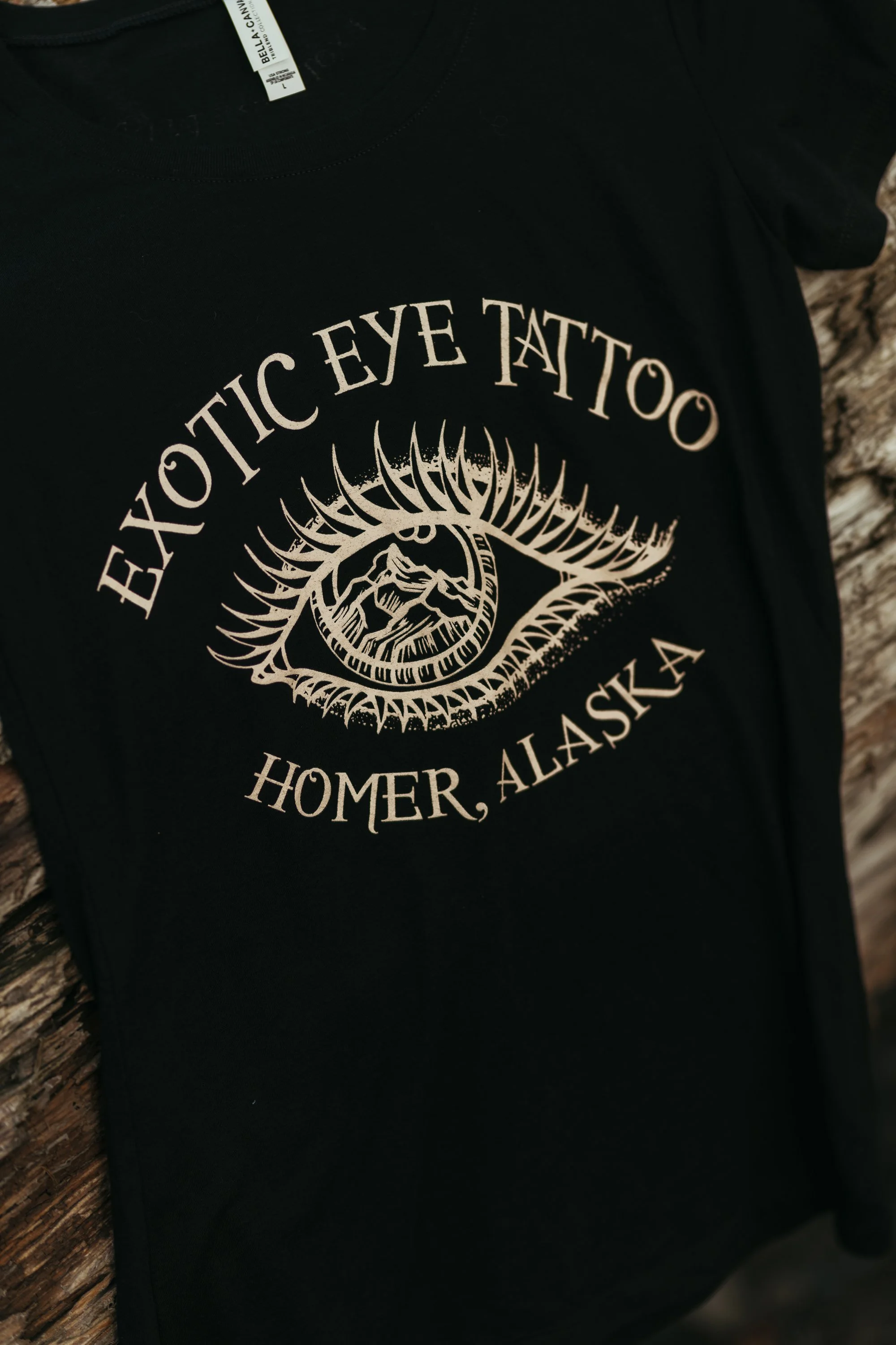 womens-fitted-tee_sacred-range-eye_black_front-detail.jpg