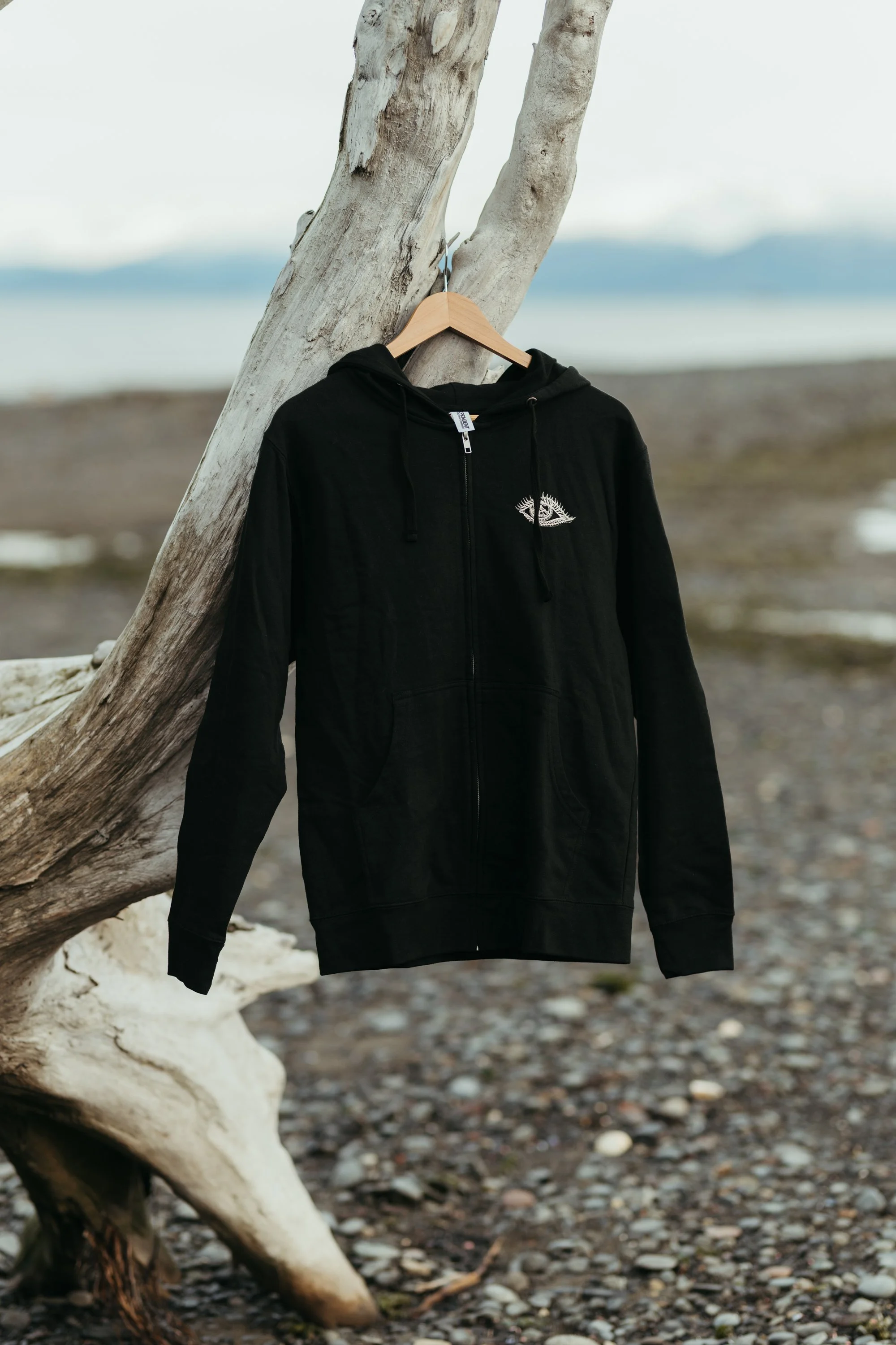 sacred-range-zip-hoodie-unisex-black-white-eye-front-01.jpg