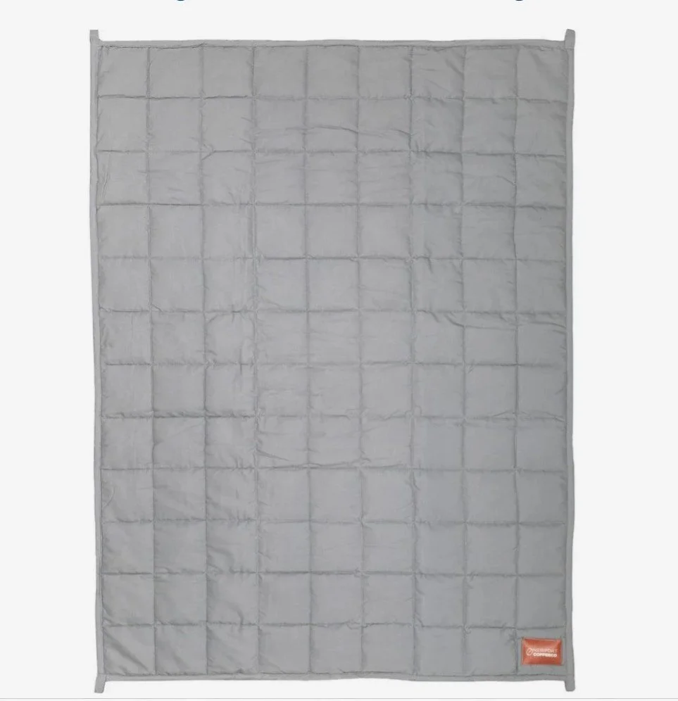 A gray weighted blanket with a grid pattern.