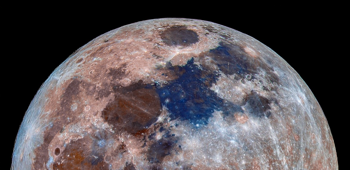 Close-up of the moon showing detailed craters and surface features with a black background.