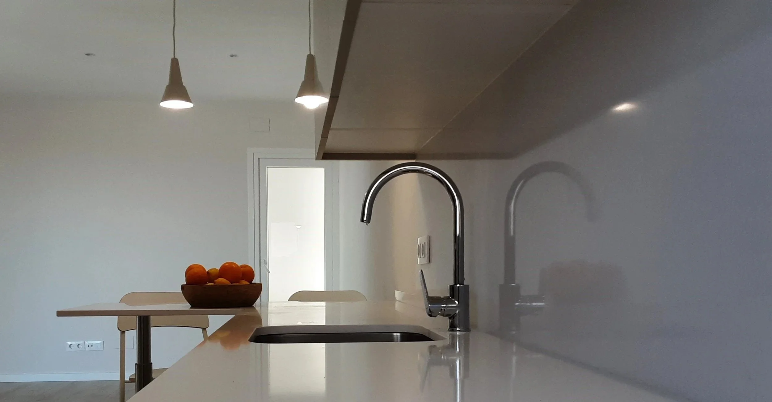 Modern bathroom with a glass-enclosed shower, wooden vanity with a vessel sink, and a large mirror with backlit lighting.