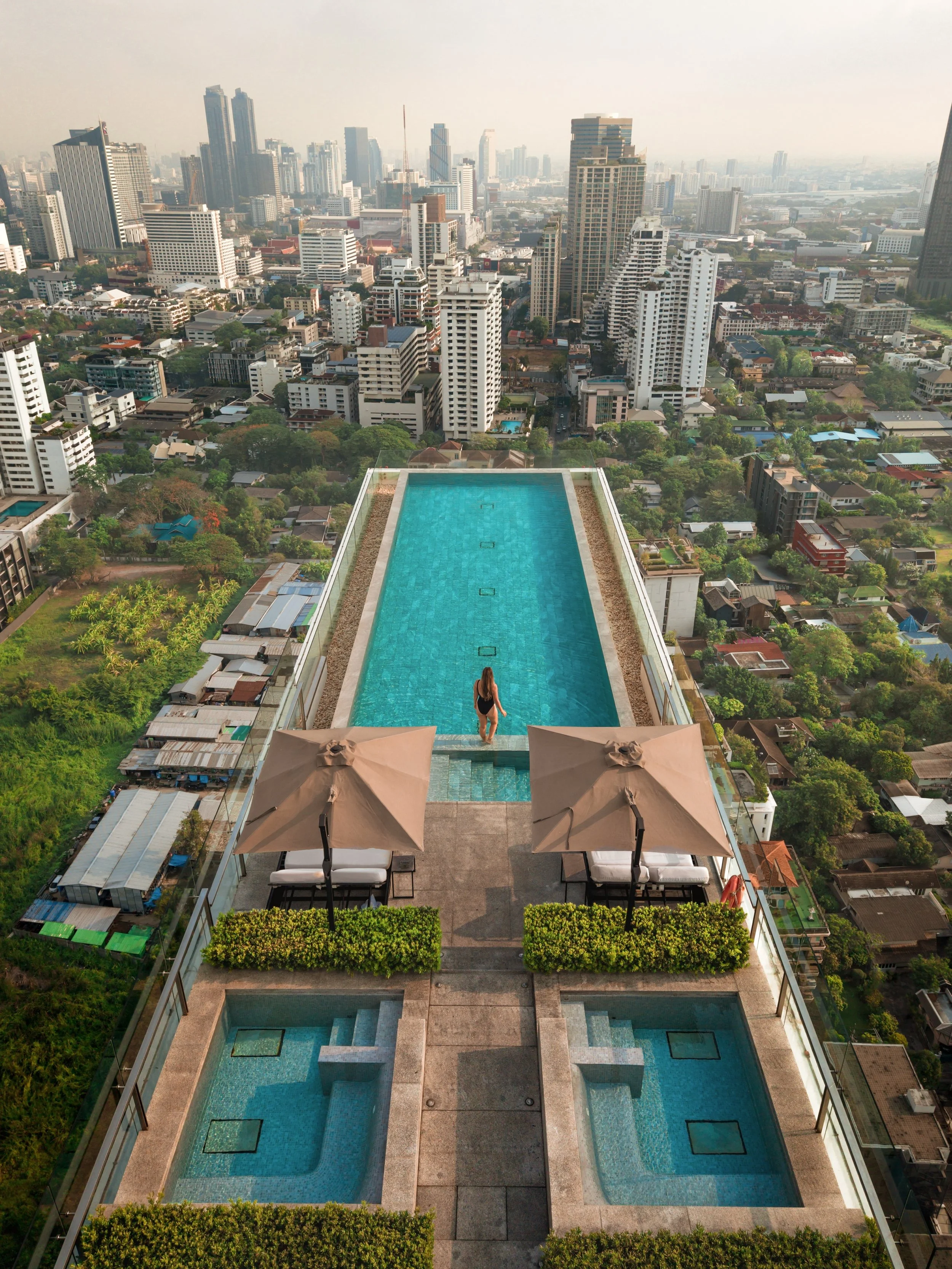 View of the skyline from one of my favourite rooftop pools.
.
📍 @137pillars_bangkok 
👧 @agirlwhoblooms 
.
#travel #thailand #bangkok #cntraveller #tlpicks