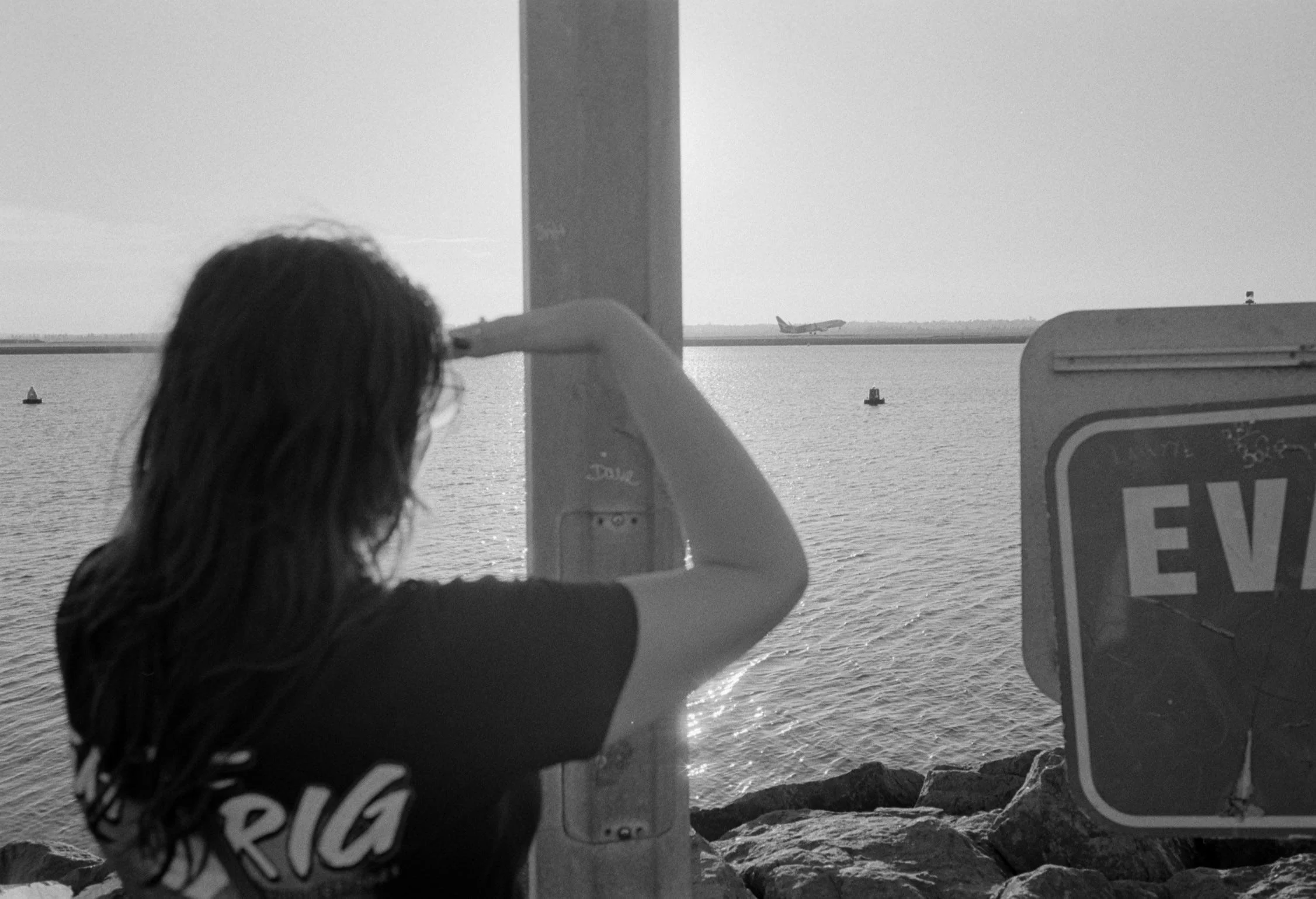 Josie looking out towards the Airport at Port Botany, captured by Hashem McAdam