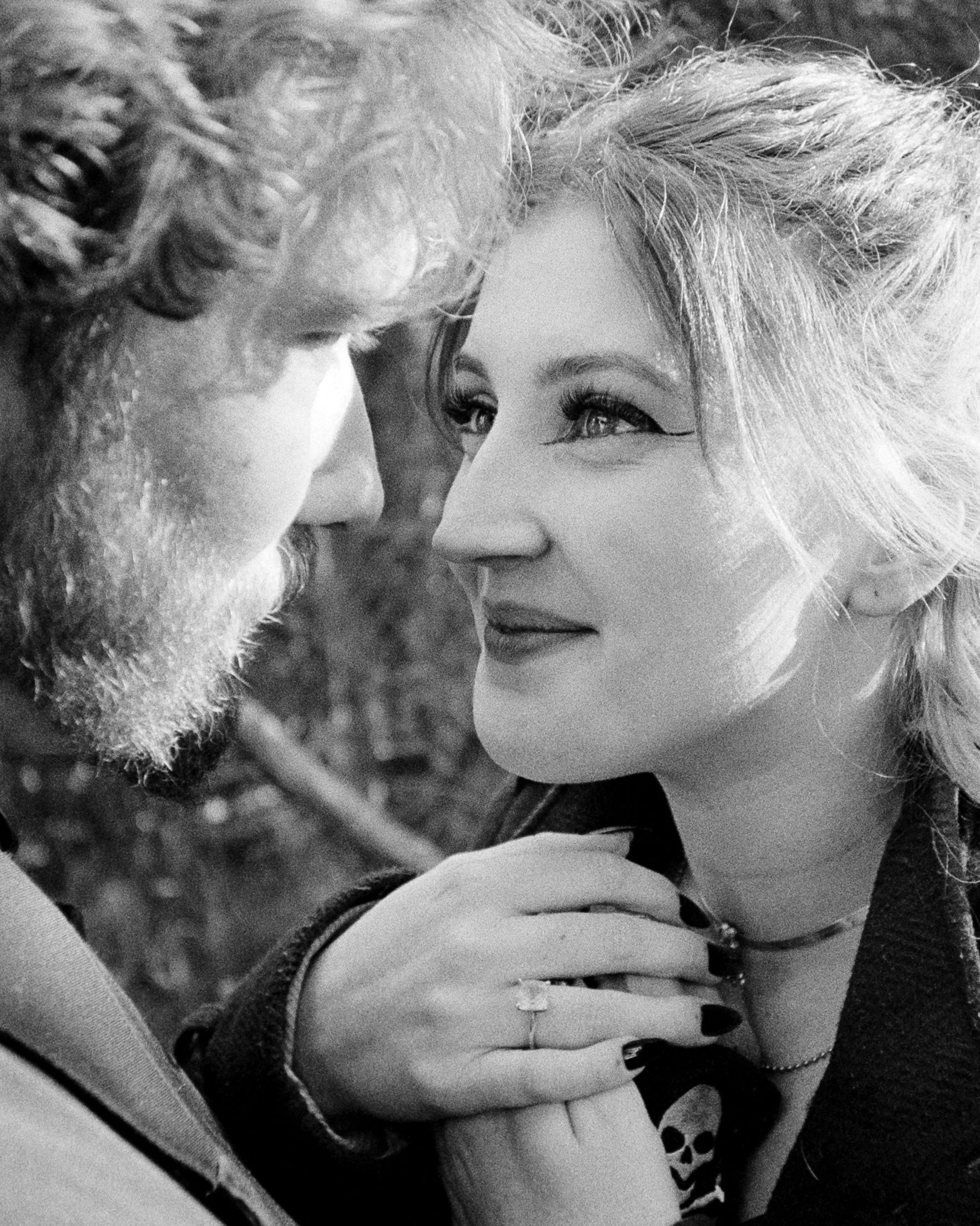 Nick and Mel on a couples shoot, looking lovingly into each other's eyes