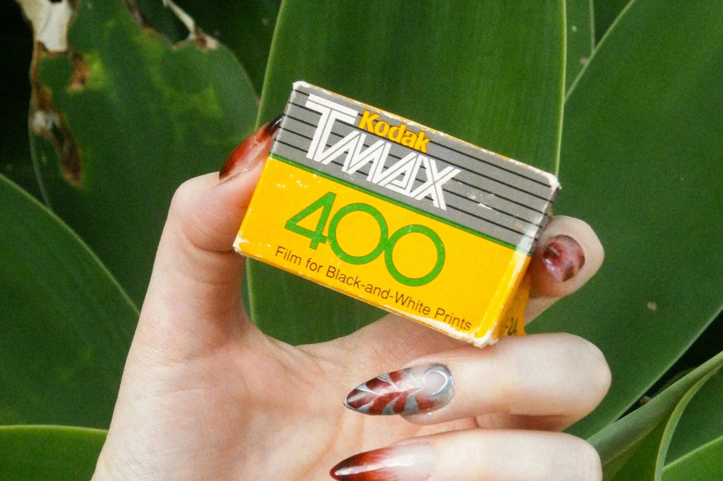 Josie holding a box of vintage Tmax 400