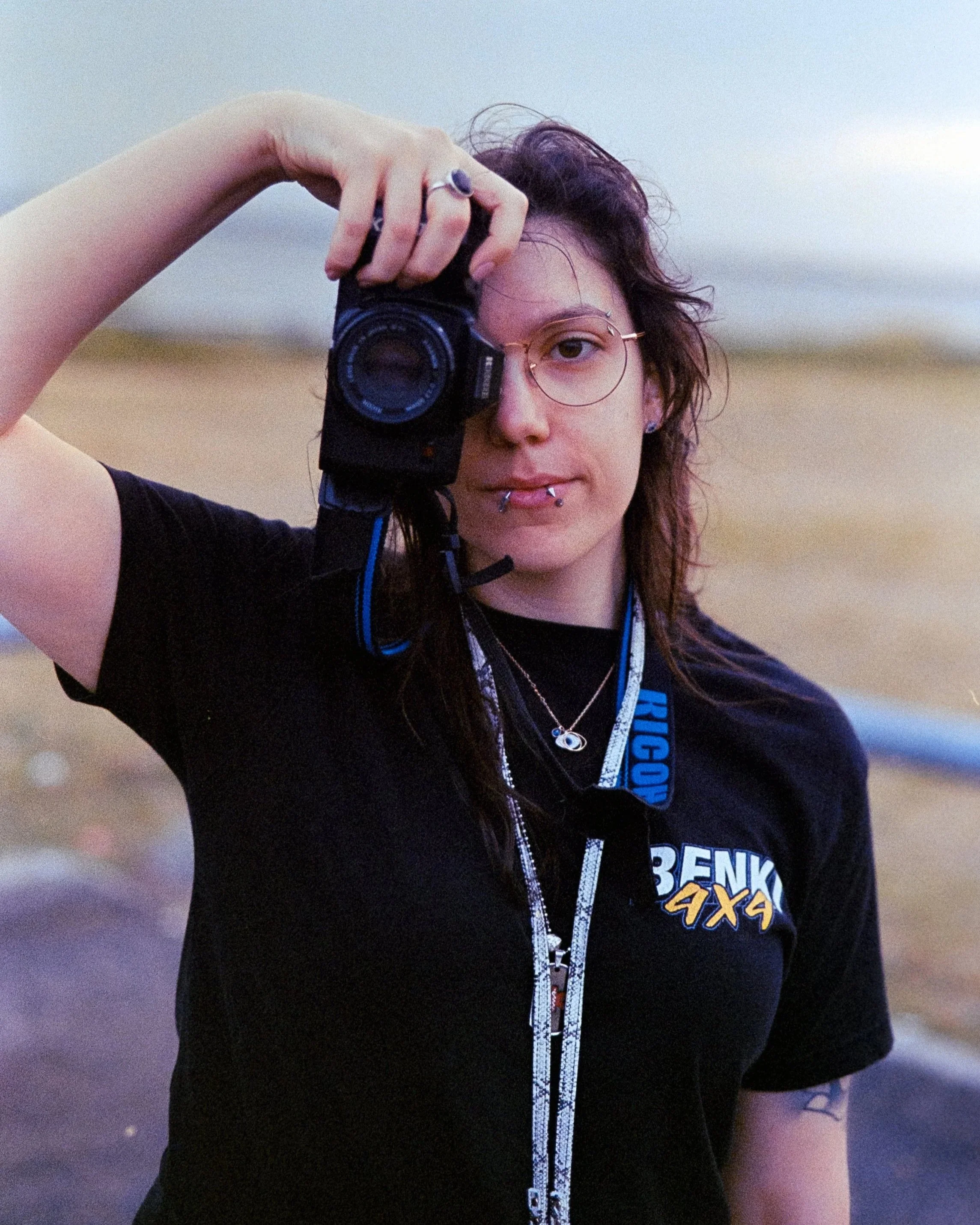 Josie holding up her Ricoh KR-10M and posing for the camera, on 35mm Film - Ultramax