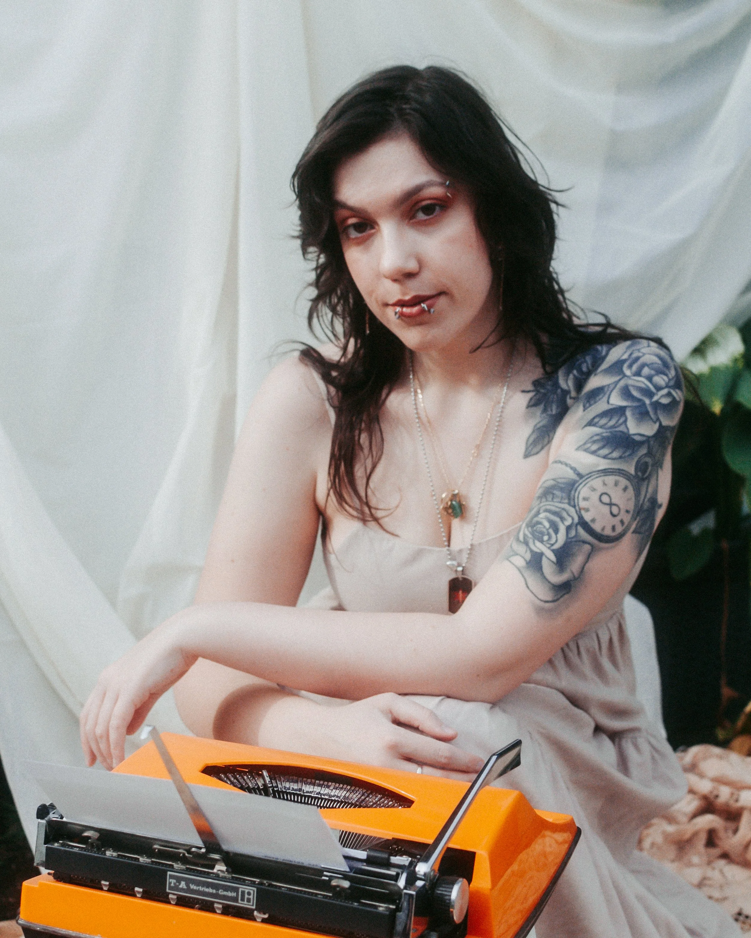 Josie with her bright orange typewriter nicknamed 'Tessa'